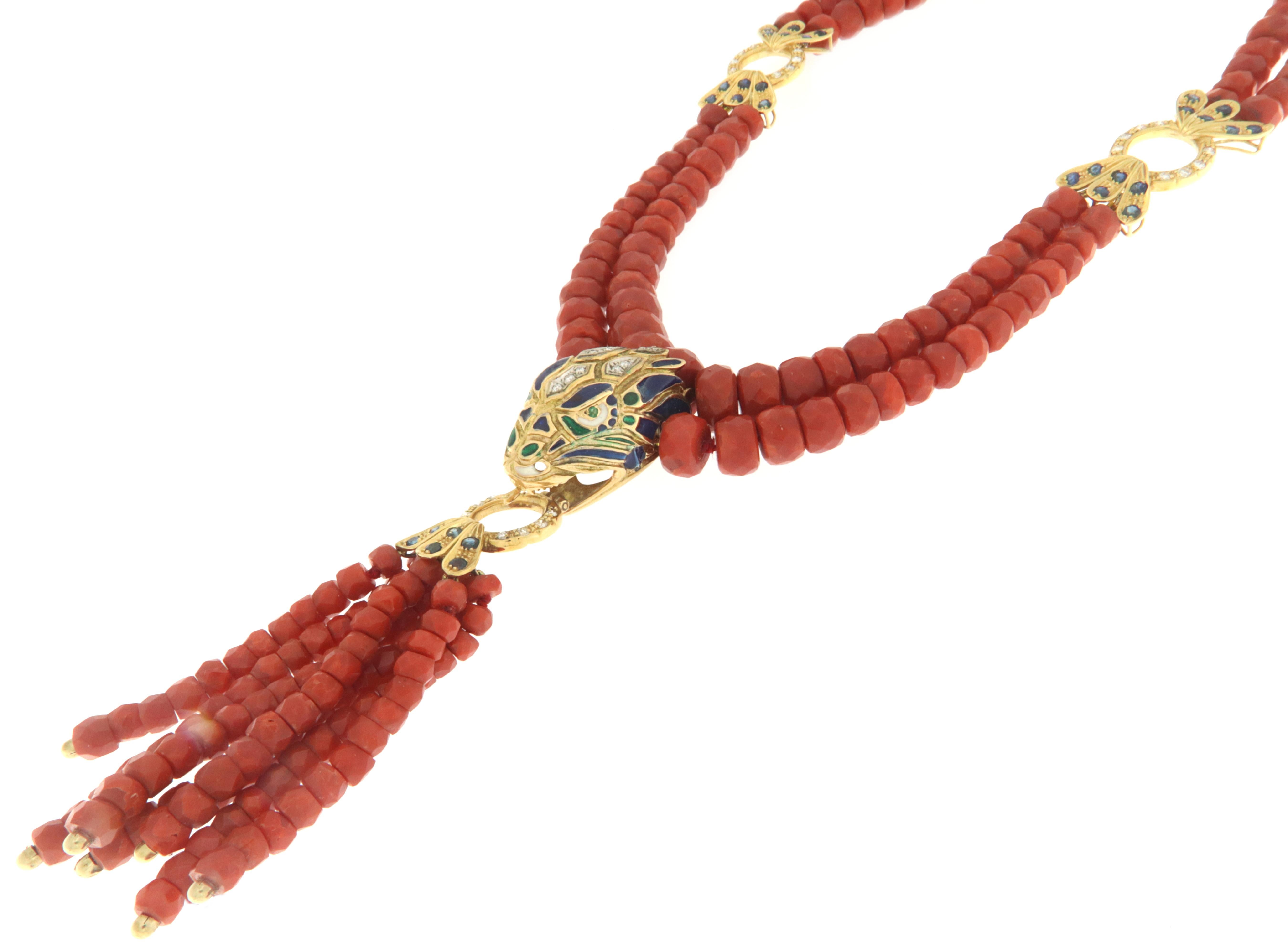 Fantastic 18 karat yellow snake pendant necklace.Snake head handmade by our artisans assembled with natural coral,sapphires,enamel and diamonds

Necklace total weight 140.50 grams
Sapphires weight 5.06 karat
Diamonds total weight 1.30 karat
Necklace