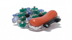 Coral, Diamonds, Sapphires, Onyx,  Agate, Platinum and 18 Kt White Gold Brooch.