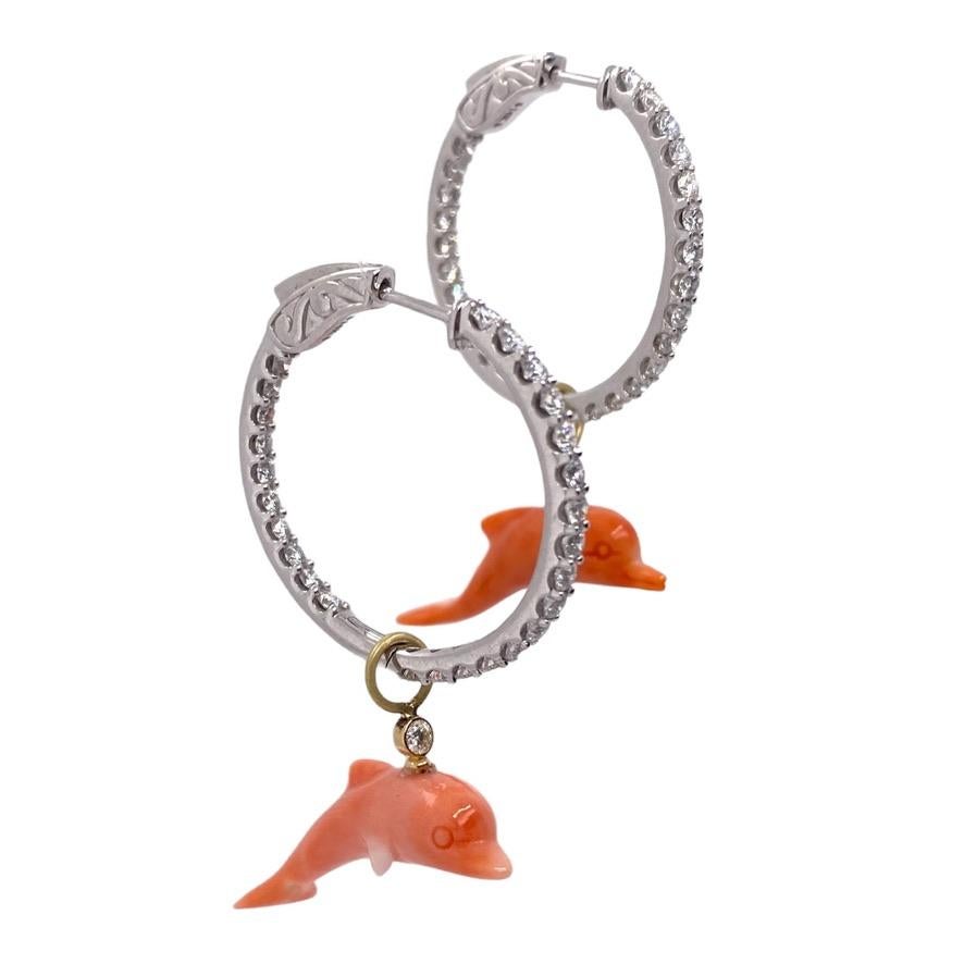 Large inside/outside diamond 14K white gold hoops with hand-carved coral dolphins & 18K yellow gold dangles with two .06ct diamonds. These earrings come with an extra pair of sterling silver hoops to swap out for a more casual look. These earrings