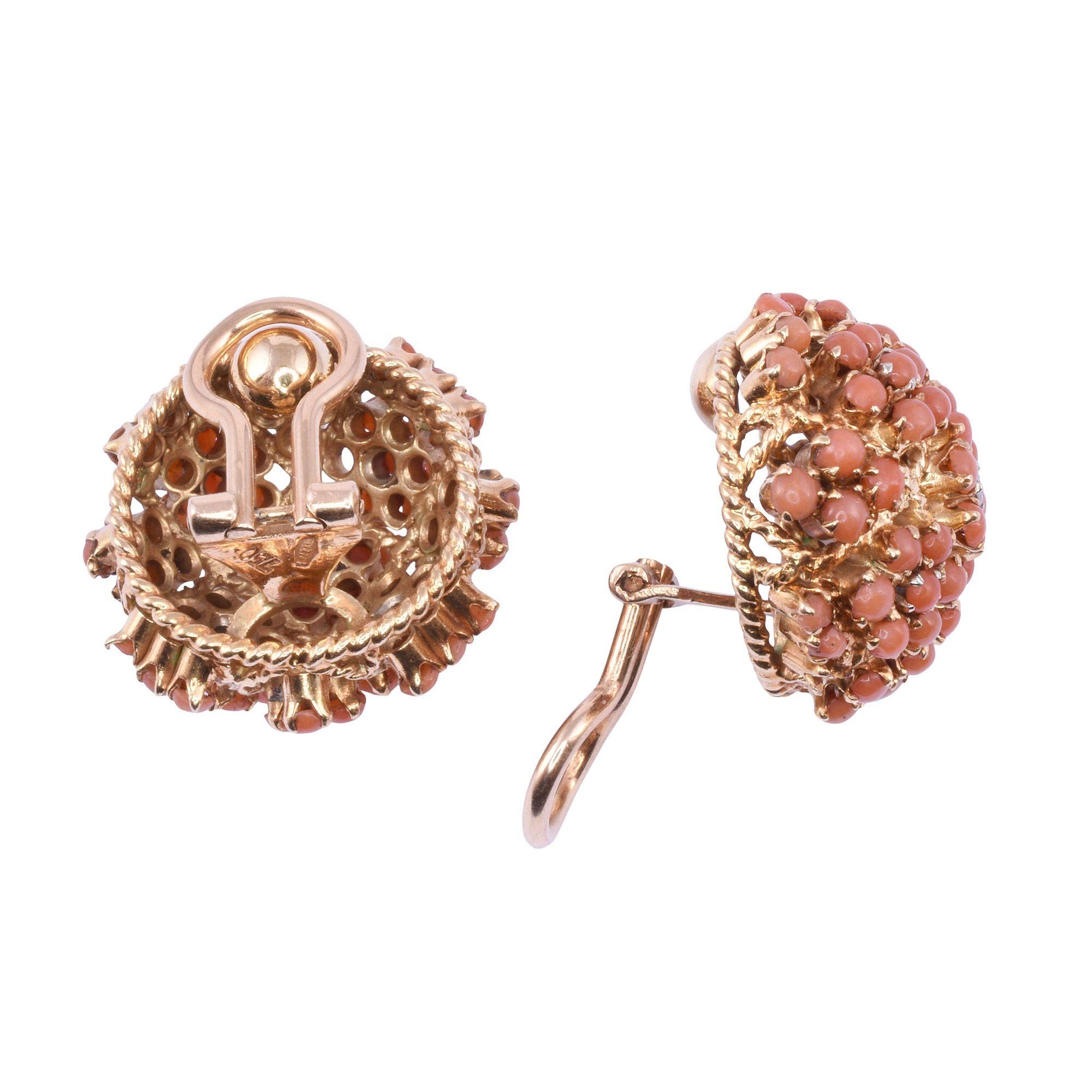 Vintage Italian coral dome 18K clip earrings, circa 1960. These 18 karat gold clip earrings feature a dome of prong set coral accented with two diamonds at .07 carat total weight. The diamonds have VS1 clarity and G-H color. [KIMH 558]
