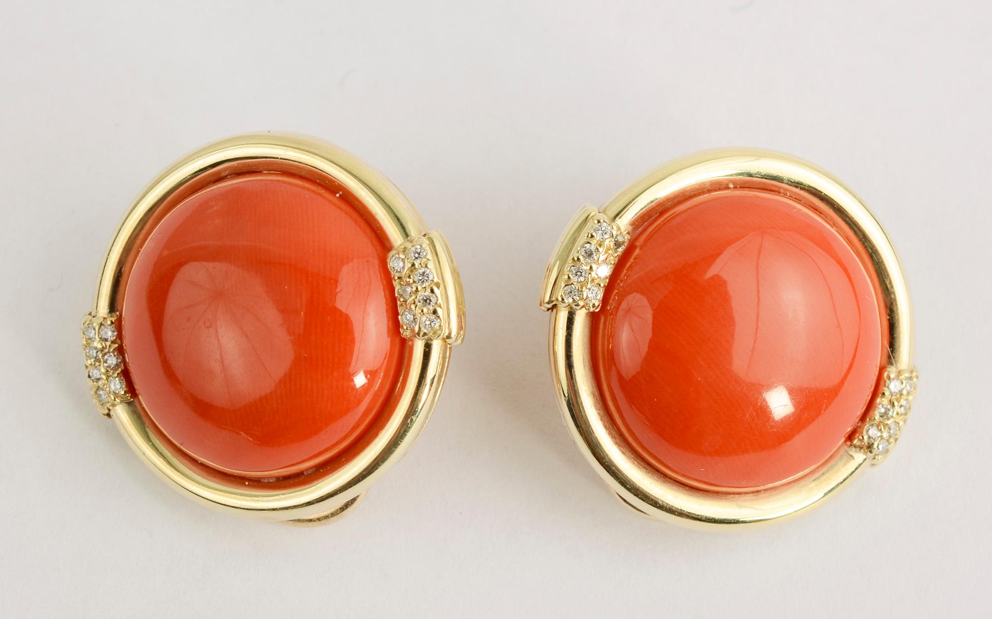 Beautifully colored coral earrings highlighted with three diamonds on either side for just a touch of bling. The earrings measure 1 inch in diameter. They appear to be signed Rio. Clip backs can be converted to posts.