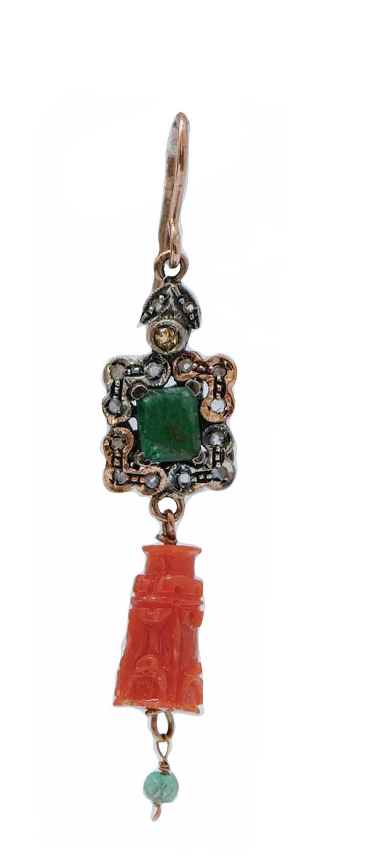 Retrò earrings in 9 kt rose gold and silver structure mounted with an emerald surrounded by a frame of diamonds and, as pendant, a carved coral with an emerald.
These earrings were totally handmade by Italian master goldsmiths and they are in