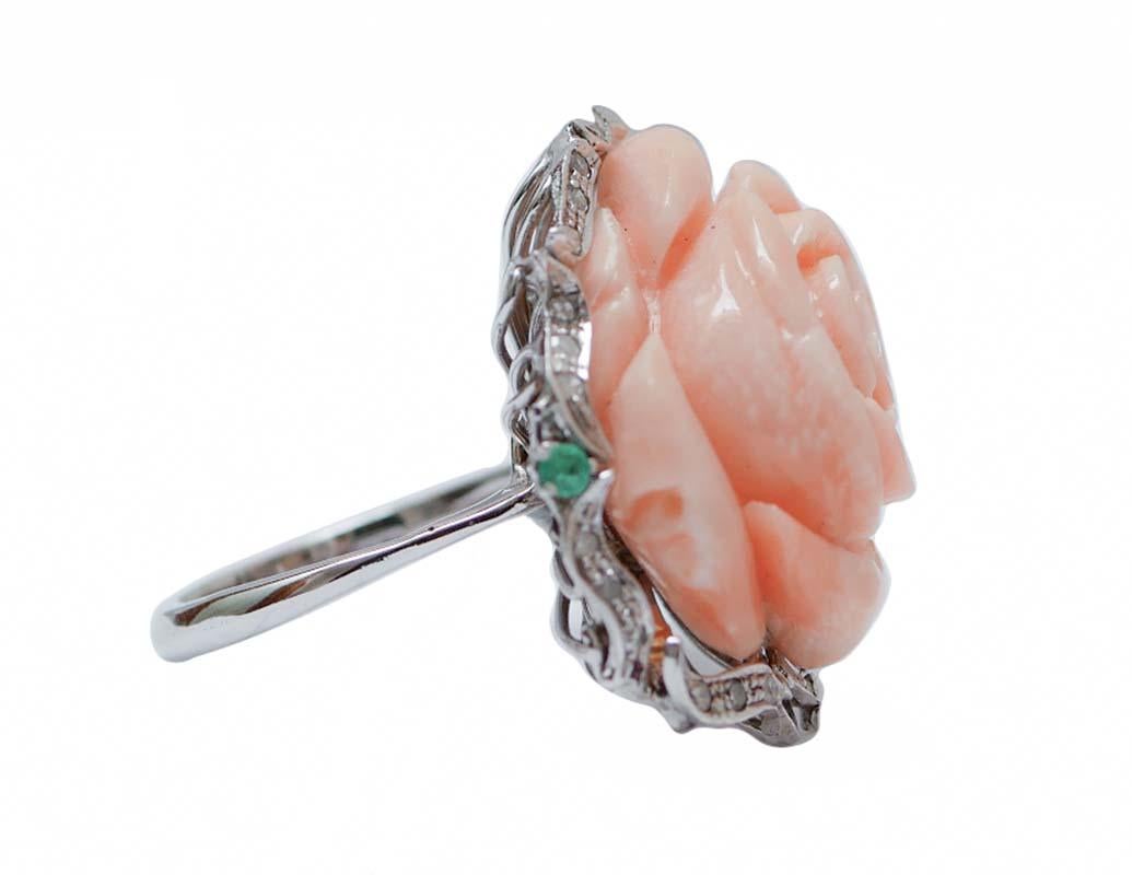 Amazing ring in 14 kt gold and rose gold structure mounted with a central flower of coral surrounded  by diamonds, sapphires, pearls and emeralds.
This ring was totally handmade by Italian master goldsmiths and it is in perfect conditions.
Diamonds