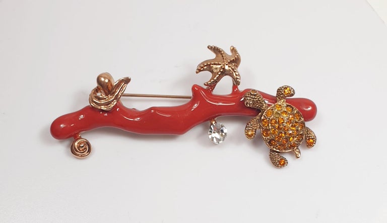 Coral Brooche with tortoise and starfish  red Enamel and Gold plated metal 
Beach Enamel Fashion Brooche inspired in Schlumberger iconic marine life 
Jean Schlumberger (pronounced ‘Shlum-Bur-Zhay’) is an iconic name in jewelry design.  He is one of