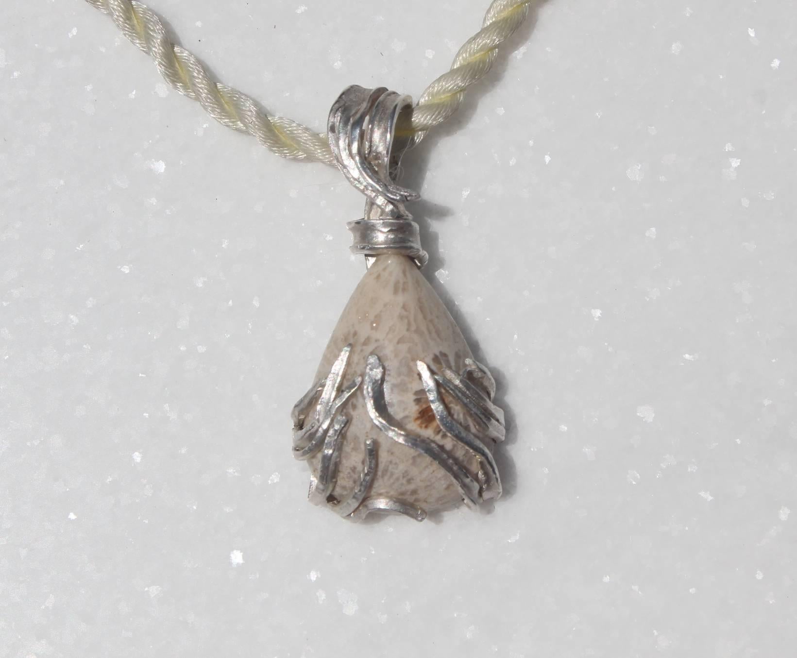 In The Sea coral fossil pendant. This one of a kind handmade drop pendant necklace is hand formed out of fine silver creating a setting for the subtly colored fossil coral. It is made to order, custom piece. Its unusual shape and a subtle coloring