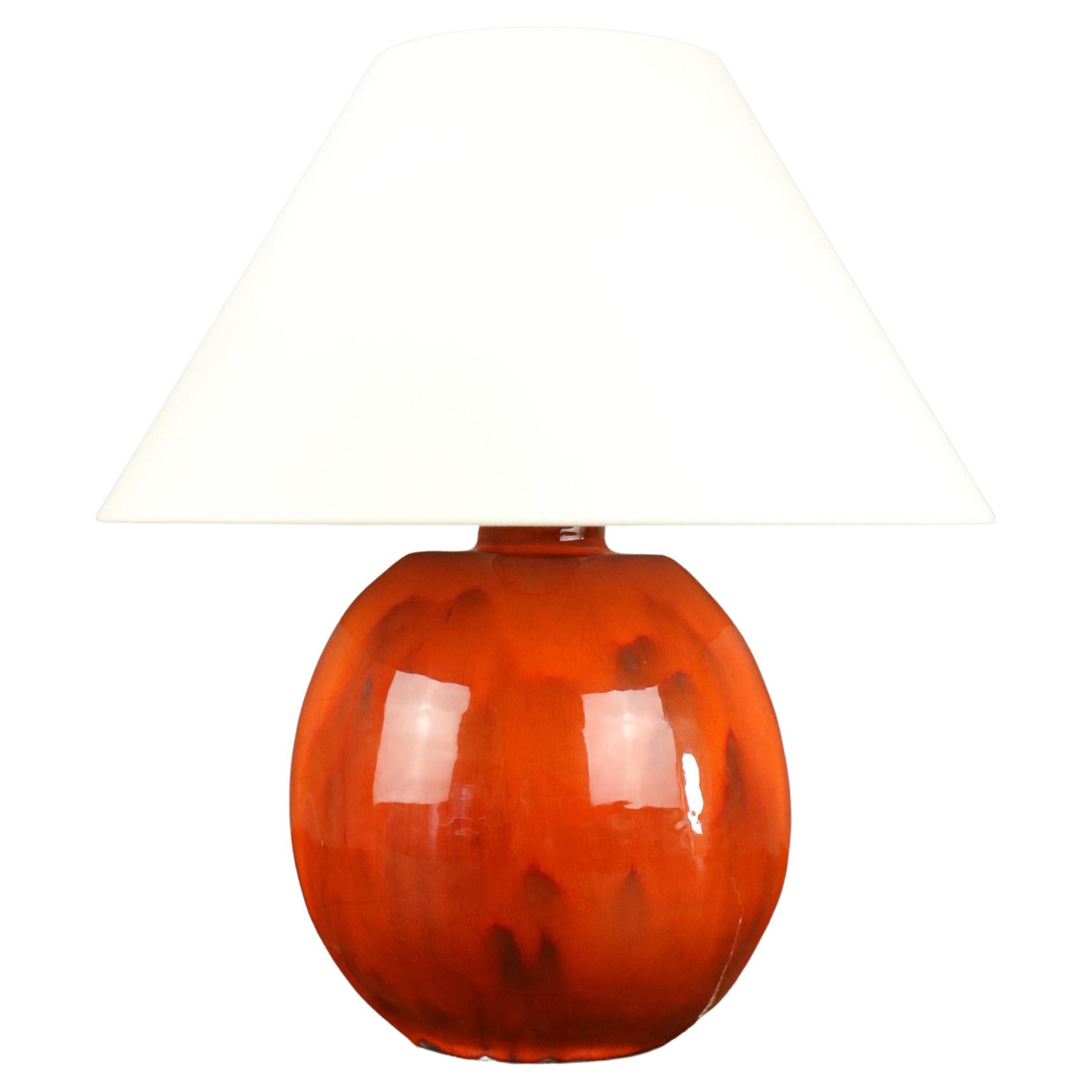 Coral-glazed ceramic lamp in the Ruelland style, 1960, France

Beautifully sized ceramic lamp with the bright, vivid enamel typical of Jacques and Dani Ruelland's creations. 

The lamp has been rewired. 
It works with a bayonet bulb (B22). 
Its