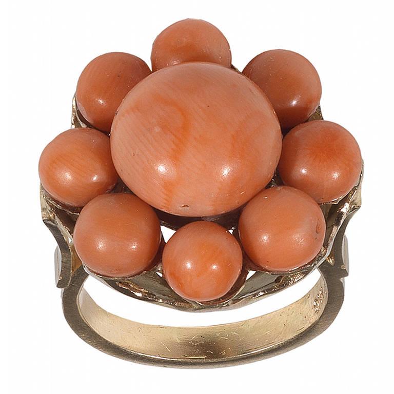 PLEASE NOTE: OUR PRICE IS FULLY INCLUSIVE OF SHIPPING, IMPORTATION TAXES & DUTIES.
Designed with a cluster top with a larger round coral bead at the centre and other eight smaller around. 

Mounted in 18Kt yellow gold.

Italy, circa 1870

Finger