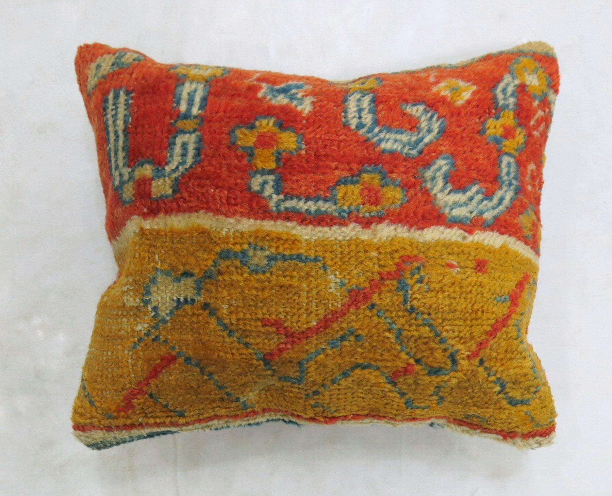 Pillow made from an early 20th century coral and gold color antique Oushak rug

Measures: 16