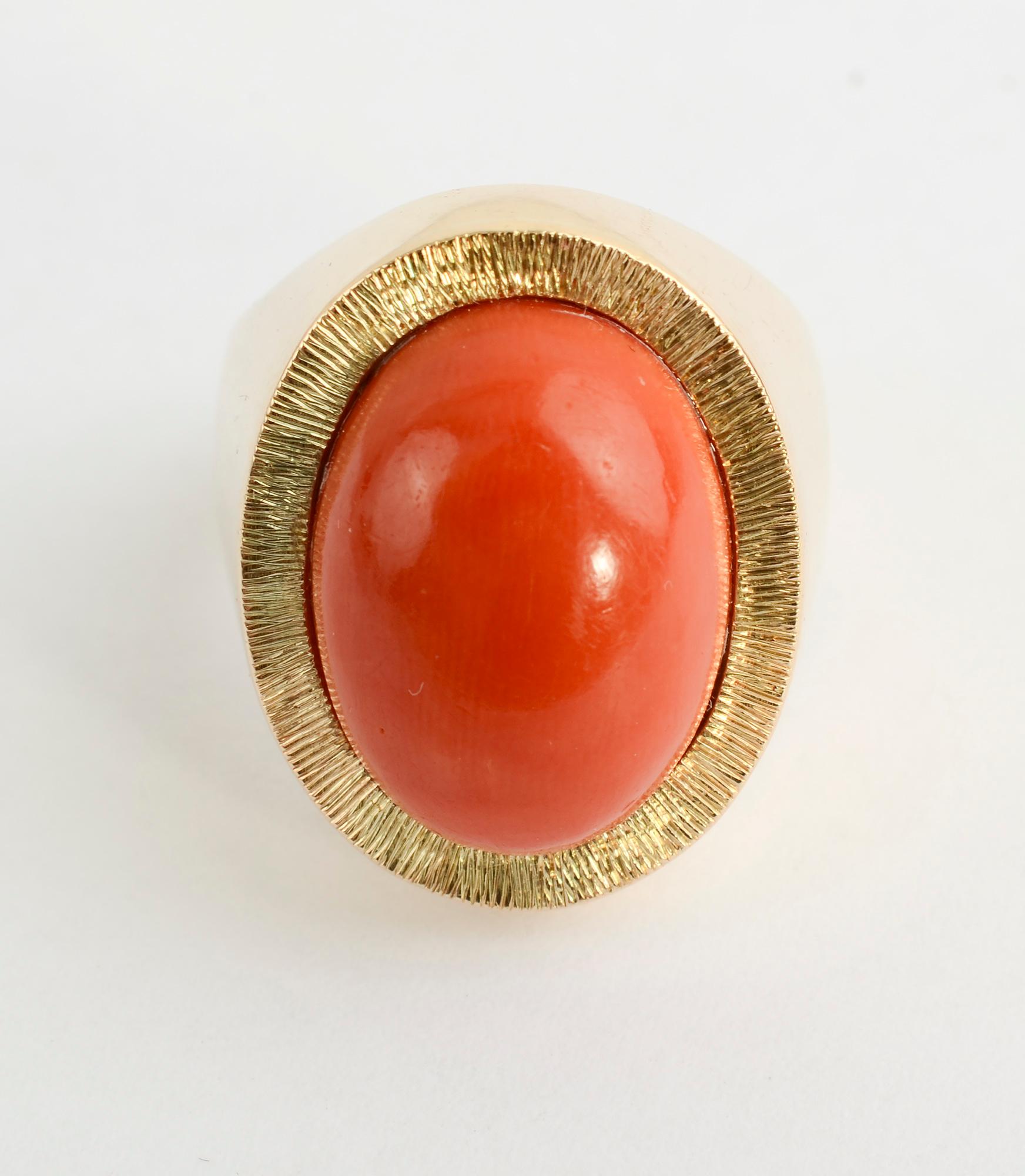 This handsome, simple and bold ring would work equally well on a man or woman.
It has a beautifully colored coral stone measuring 5/8