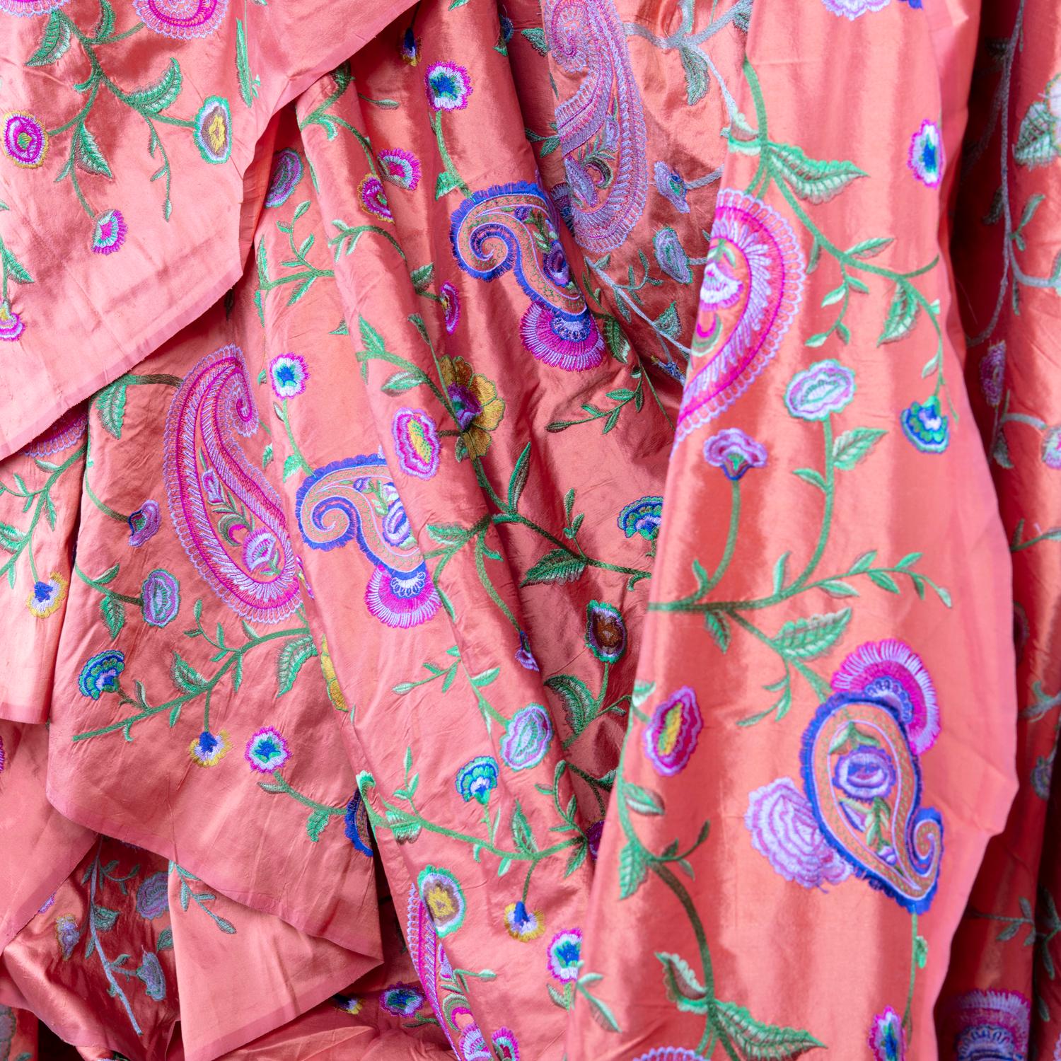 This unique vintage handicraft made by tailored artisans, is likely to never to be created again. This brilliant coral colored raw silk woven into a fine satin weave and embellished with hand-hooked embroidery known as 
