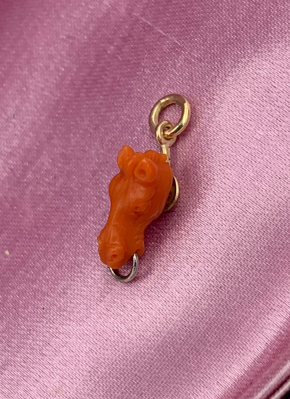 A stunning antique Victorian - Art Deco Pendant or Charm of a Horse head in gorgeous hand carved natural Coral.  The coral horse head pendant is a masterpiece of artistic expression - the face is carved with exquisite detail throughout!  The horse
