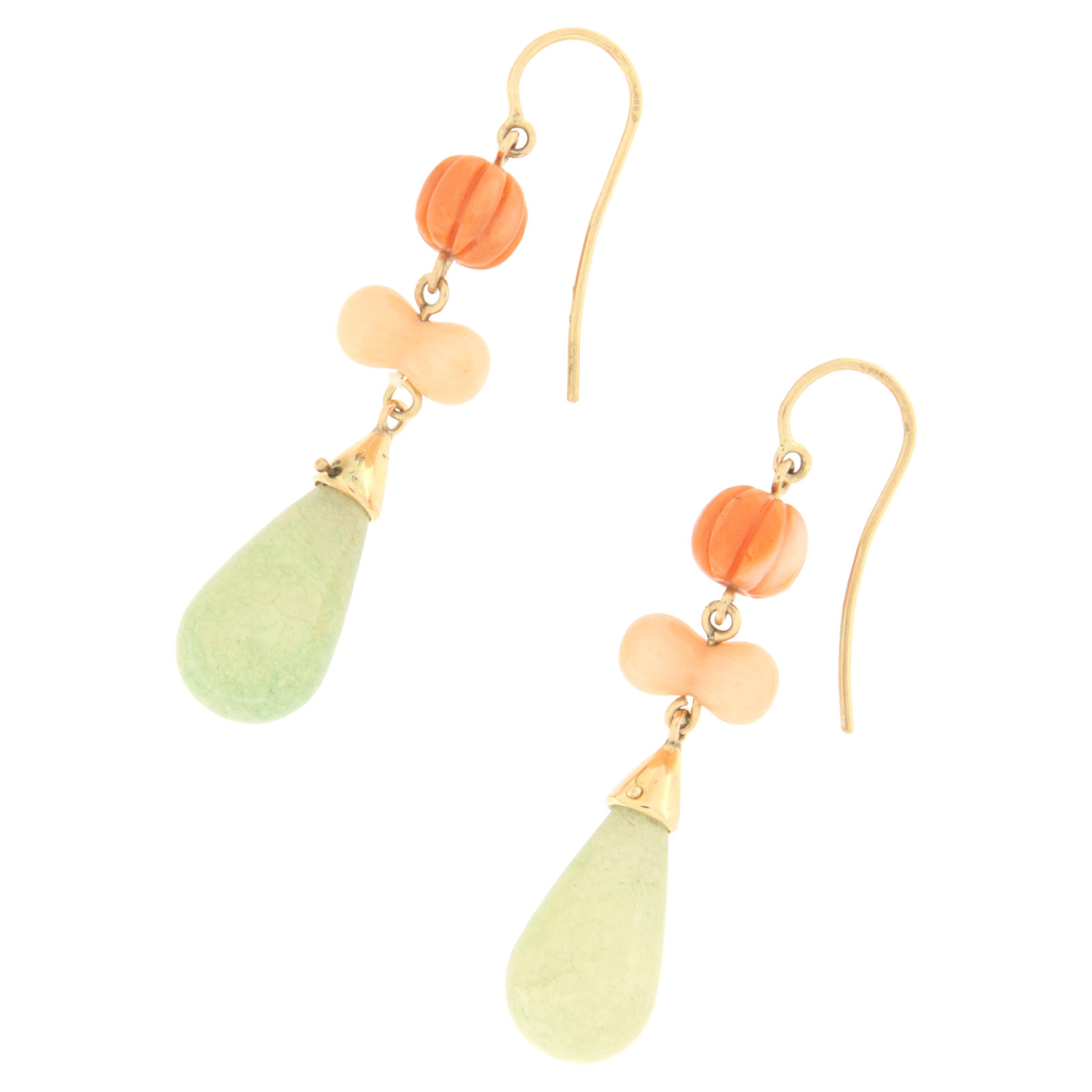 14 karat yellow gold drop earrings. Handmade by artisans made with coral and drop jade

Earrings total weight 8.70 grams
