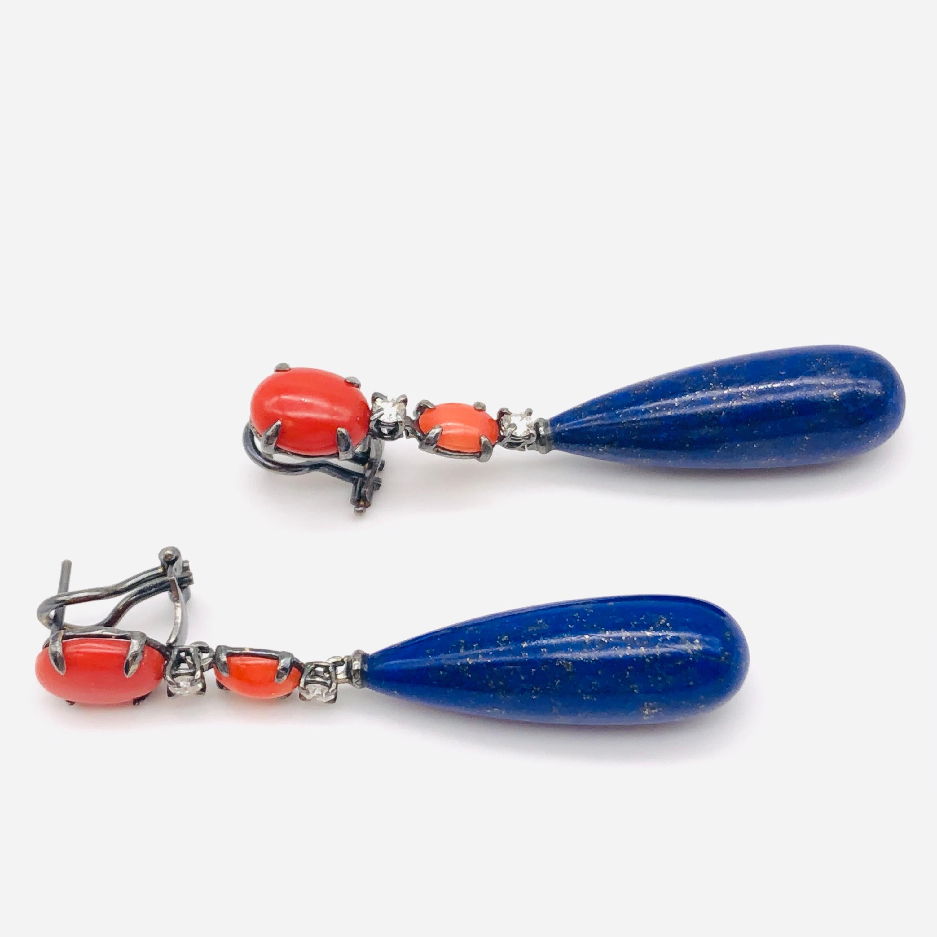 Wonderful Black Gold Coral, Diamonds and Lapis Lazuli Chandelier Earrings.
French Collection by Mesure et Art du Temps.

This ring is in black Gold of 18 Carat.  The Diamonds weight 0,32 Carat. 
There is Coral and Lapis Lazuli, the benefit of the