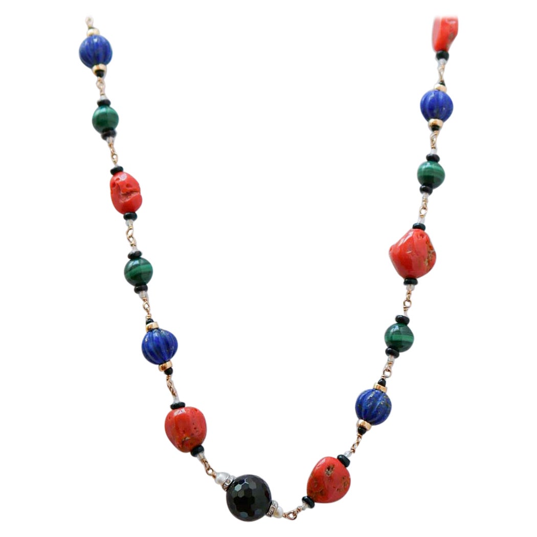 Coral, Lapis, Malakite, Onyx, Diamonds, Pearls, Rock Crystal, Gold Necklace.