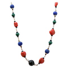 Coral, Lapis, Malakite, Onyx, Diamonds, Pearls, Rock Crystal, Gold Necklace.