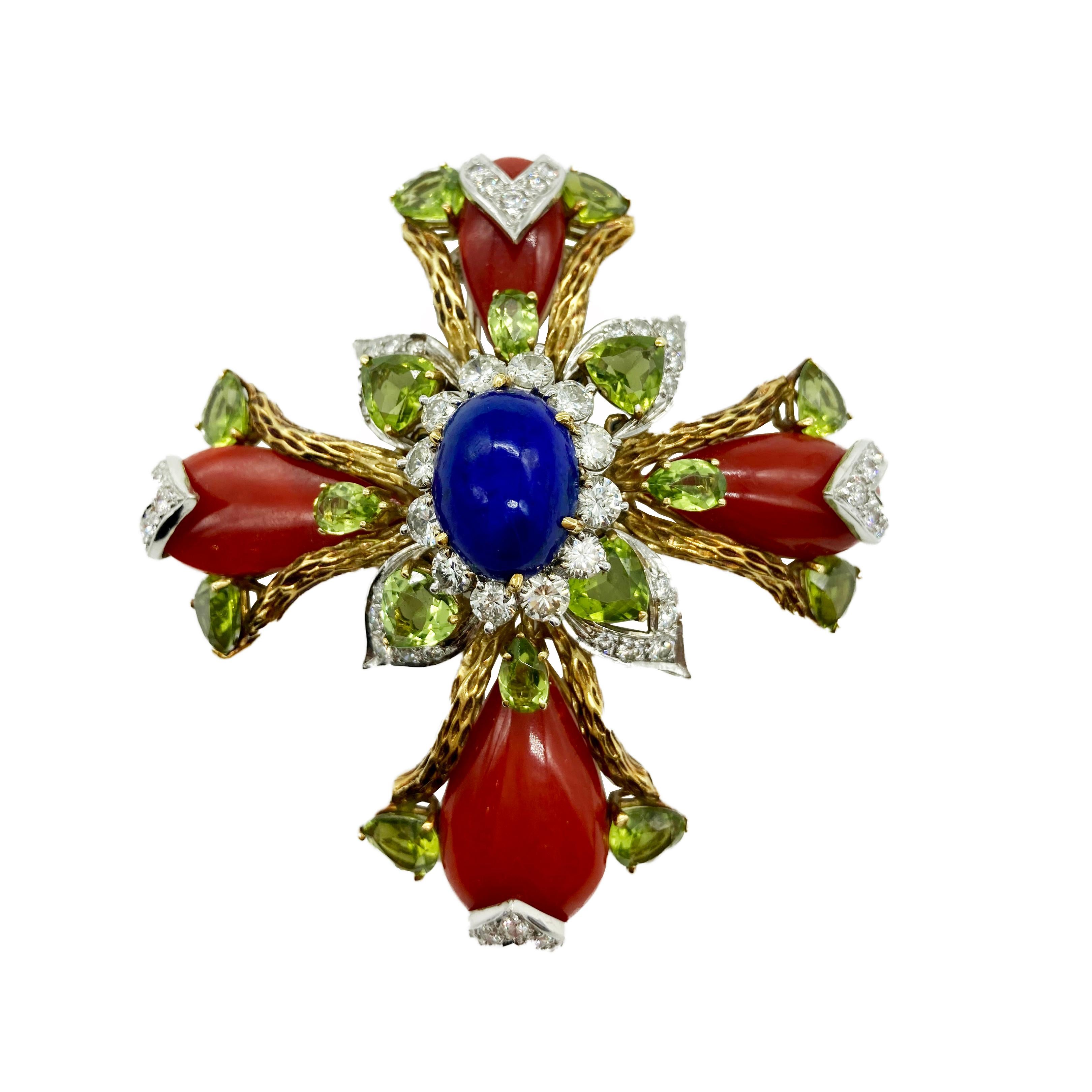 A chic statement brooch of cross design featuring coral, lapis, peridot, and diamonds. Circa 1960s.
