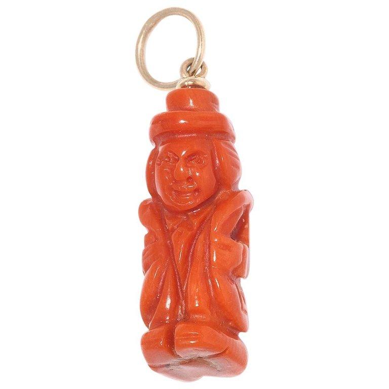 
A corallum pendant carved as a hunchback. Weight 3,5 g, height 2,4 cm.