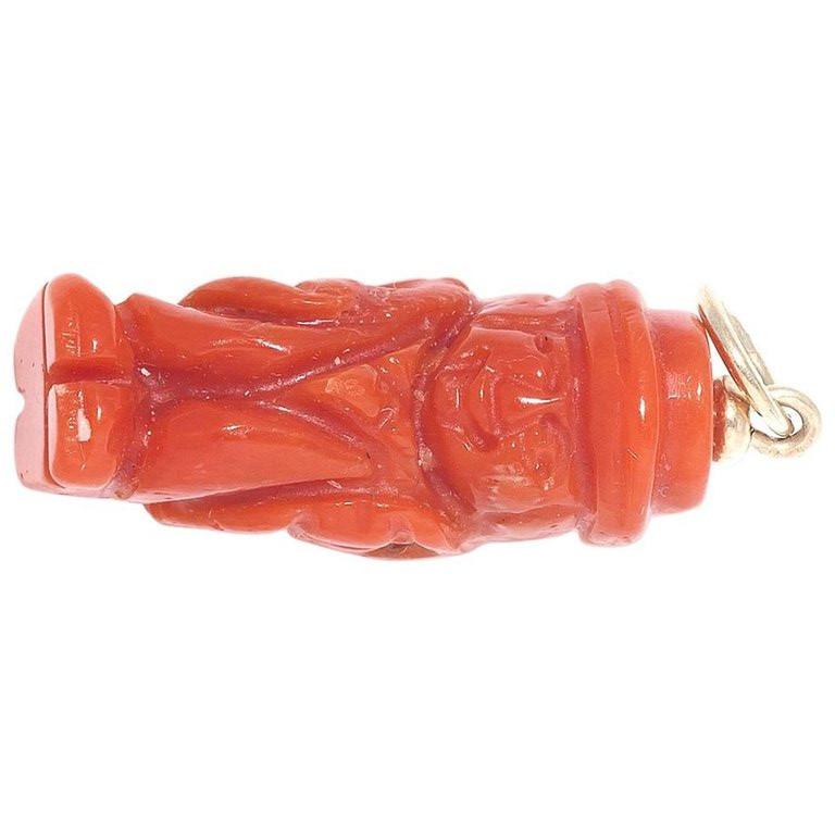


A coral pendant carved as a hunchback. Weight 3,4 g, height 2,4 cm.