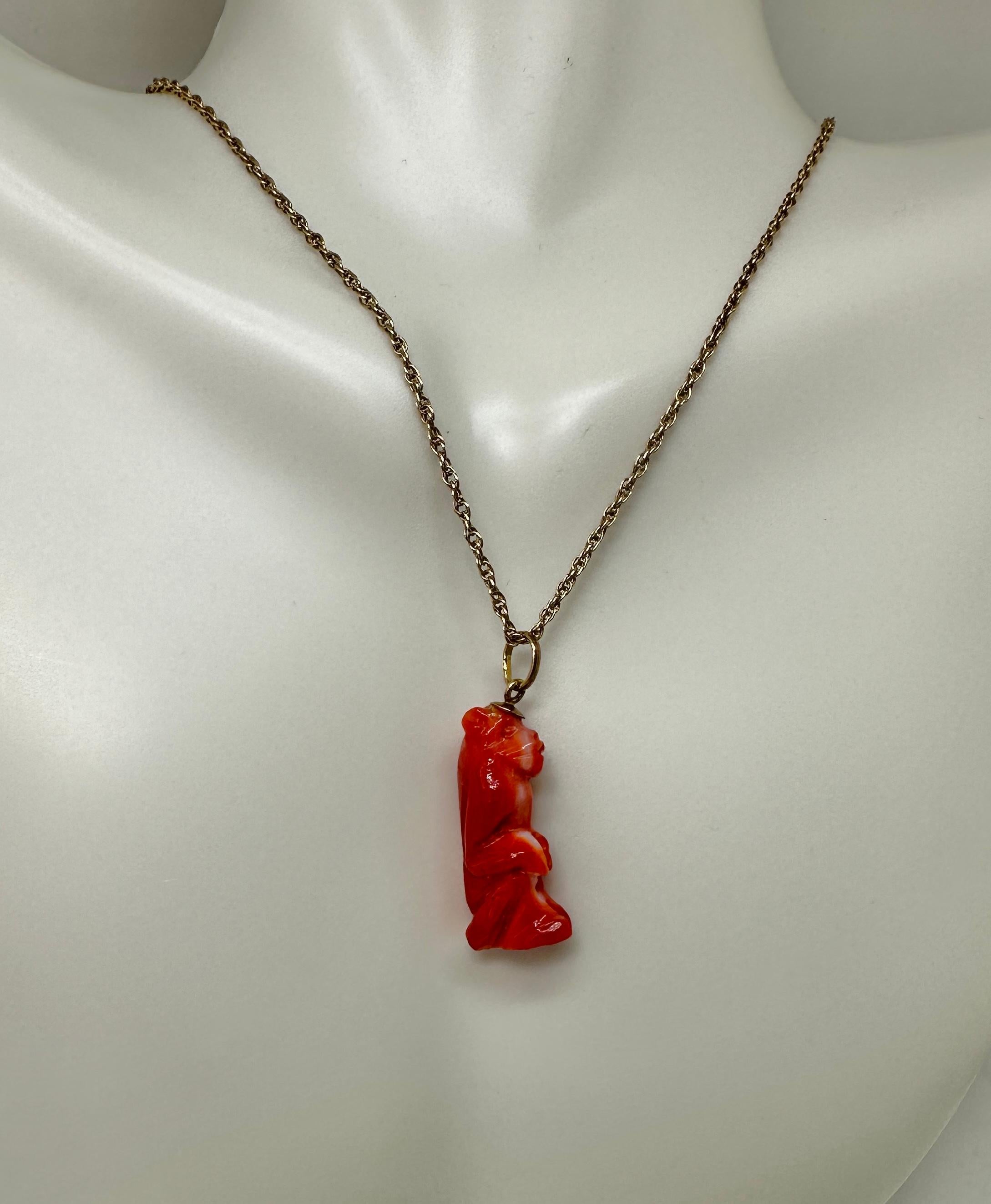 This is a stunning antique Art Deco Pendant or Charm of a Monkey in gorgeous hand carved natural Coral and set in 18 Karat Yellow Gold.  The coral monkey pendant is a masterpiece of artistic expression - the monkey is carved with exquisite detail