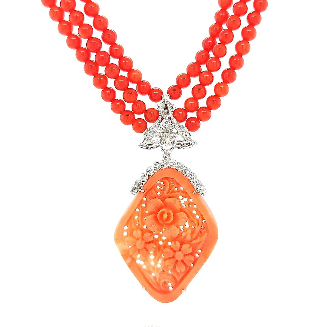 Coral Necklace With Floral Coral Removable Pendant set with 0.28 Carat Diamonds 

Can be worn as a choker with the removable coral hanger or without and long as well thanks to the long chain in the back !

Amazing necklace to shine on every
