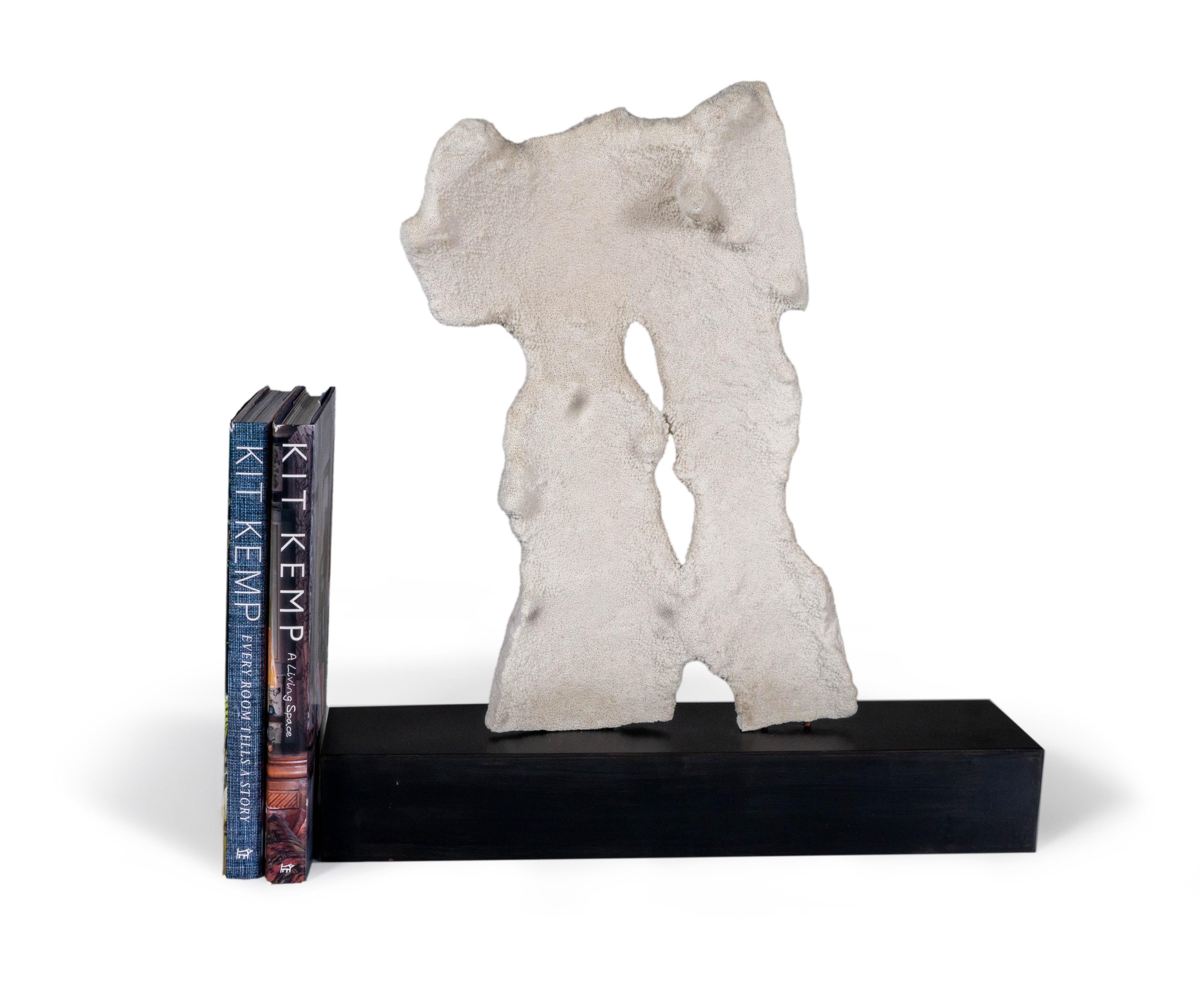 This sculpture combines the beauty of coral and oxidized metal. A perfect combination of natural elements and home decor pieces, this sculpture will take your living space to the next level. A perfectly balanced pairing of manmade and natural