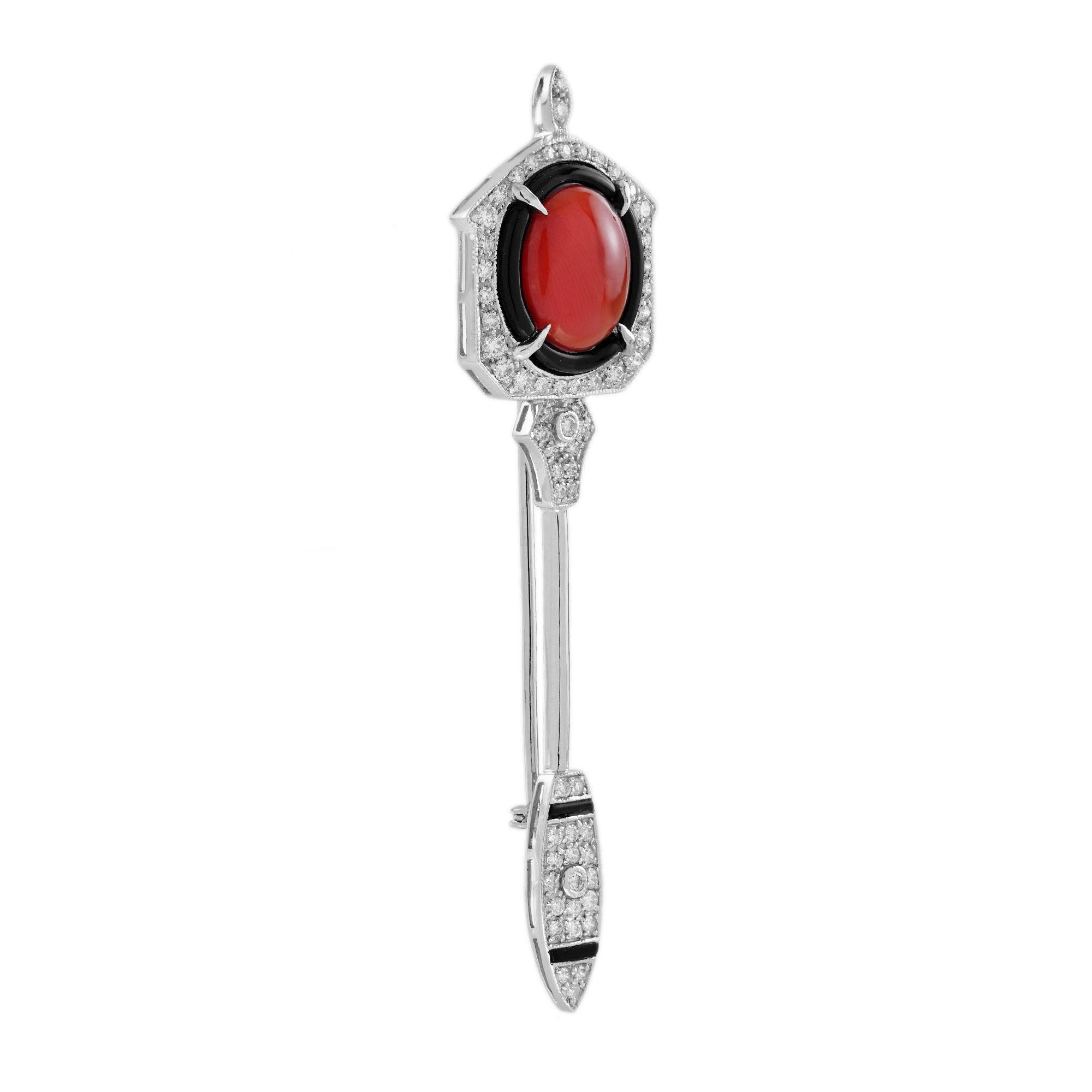 Precioso broche realizado con una rara combinación de coral, diamantes y ónices. El magnífico cabujón de coral está engastado en oro blanco y adornado con un milgrain. El brillo perfecto de los diamantes y el ónice resalta la belleza del naranja del