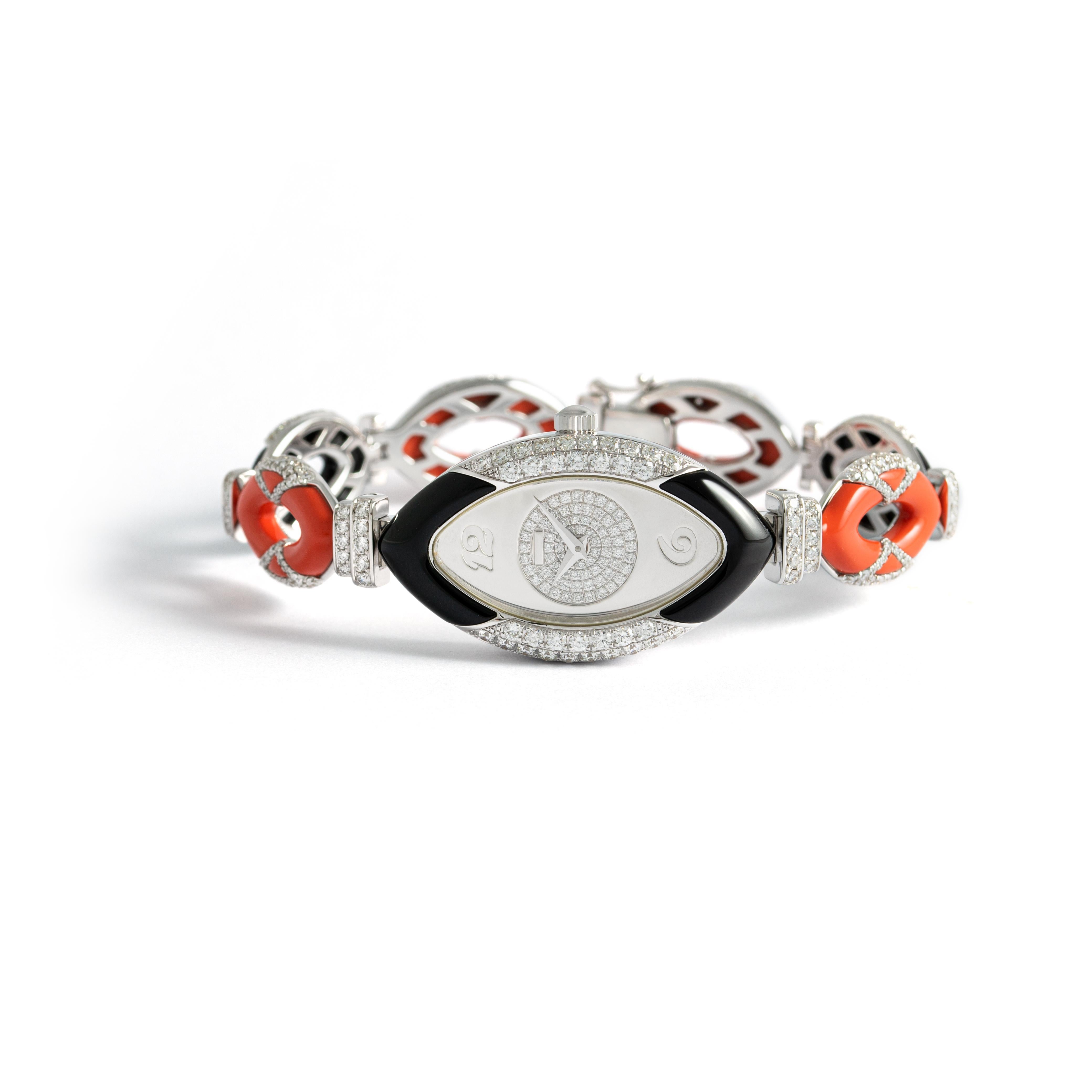 Watch in white gold 18kt set with 16 coral 7.64 cts, 10 onyx 7.48 cts case dial and bracelet set with 393 diamonds 3.41 cts quartz movement

Inner circumference: Approximately 16.64 centimeters ( 6.55 inches)

Total weight: 51.20 grams.

Width on