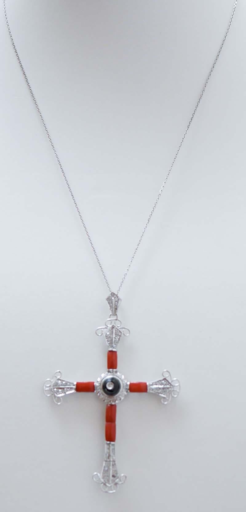 Incredibile collana con ciondolo a croce con struttura in platino montata con un'onice centrale con diamante circondata da diamanti e corallo.
La catena in oro bianco 9 kt è inclusa.
Diamanti 0,75 ct
Corallo 0.50 gr
Onice 0.30 gr
Peso totale 12,50