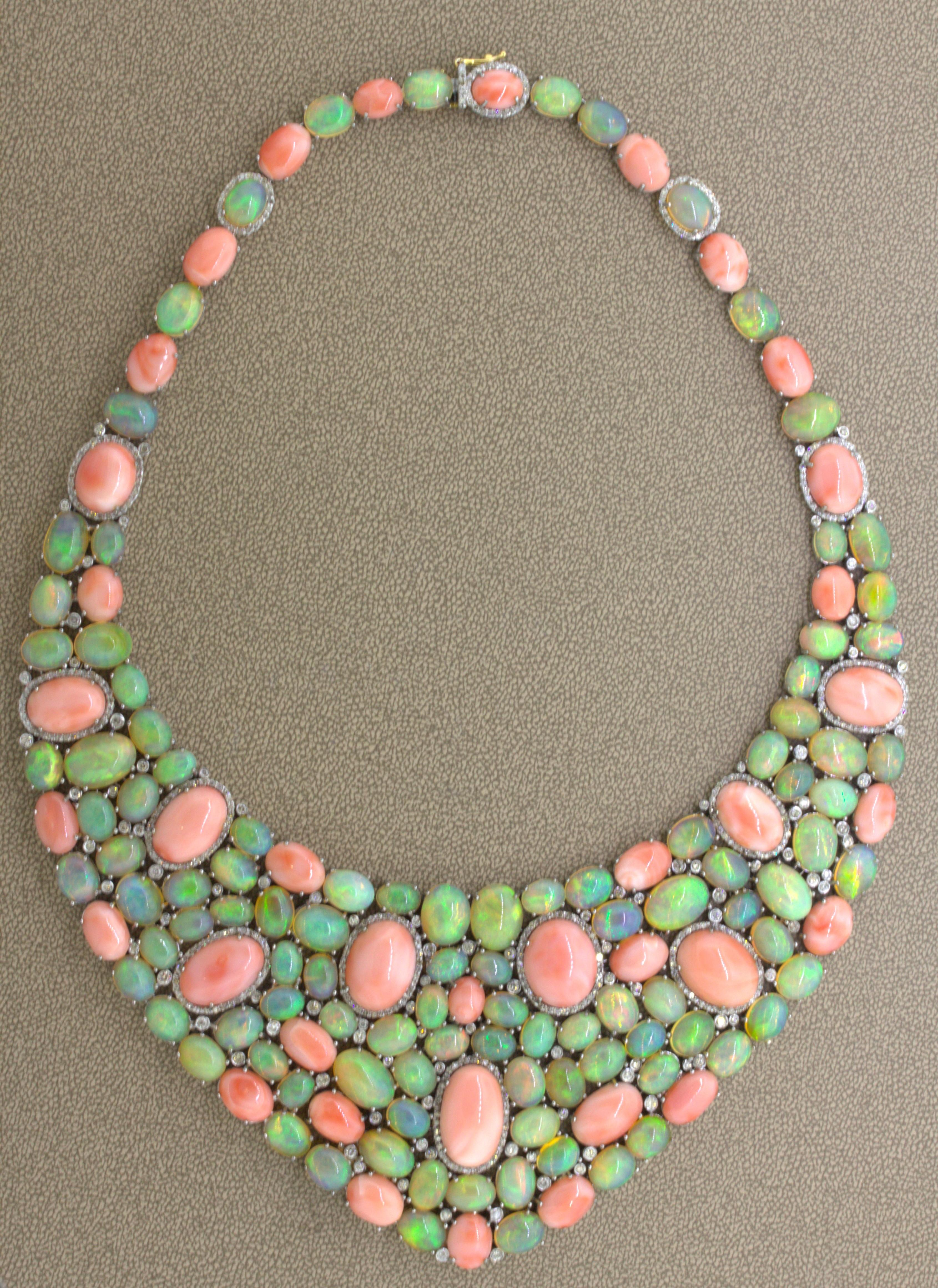 A large and impressive necklace full of color and sparkle! It features a combination of beautiful Italian coral and crystal opal weighing approximately 400 carats! The coral have a rich pink color known in the trade as “angel skill” for very fine