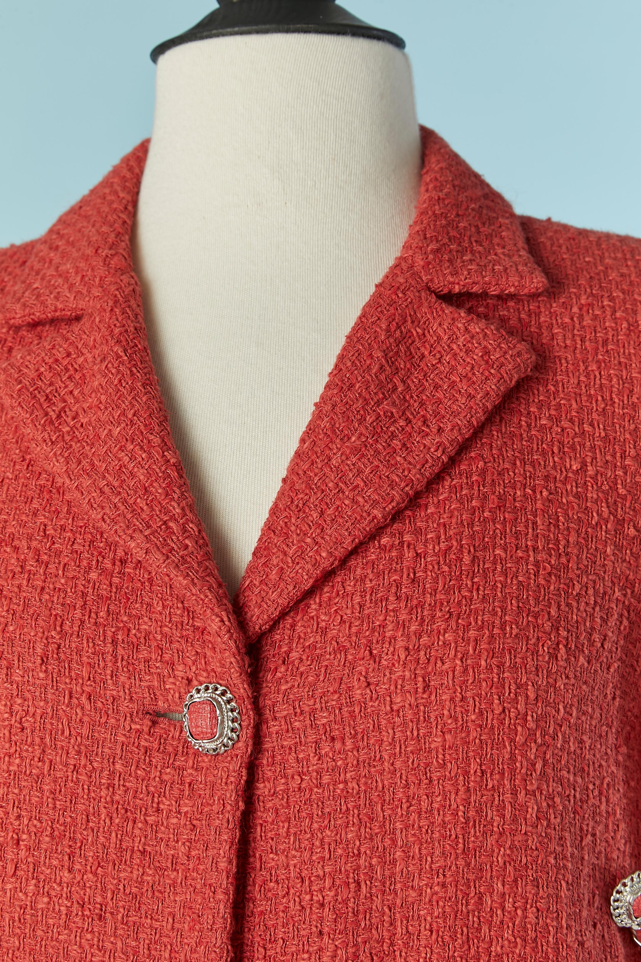 Coral orange single breasted jacket open on the side and chain. Main fabric composition: 72% cotton, 22% rayon, 5% linen, 1% nylon. Silk branded lining. 
One button closure on the middle front. 2 chains ( mix with fabric) on both side to hold the