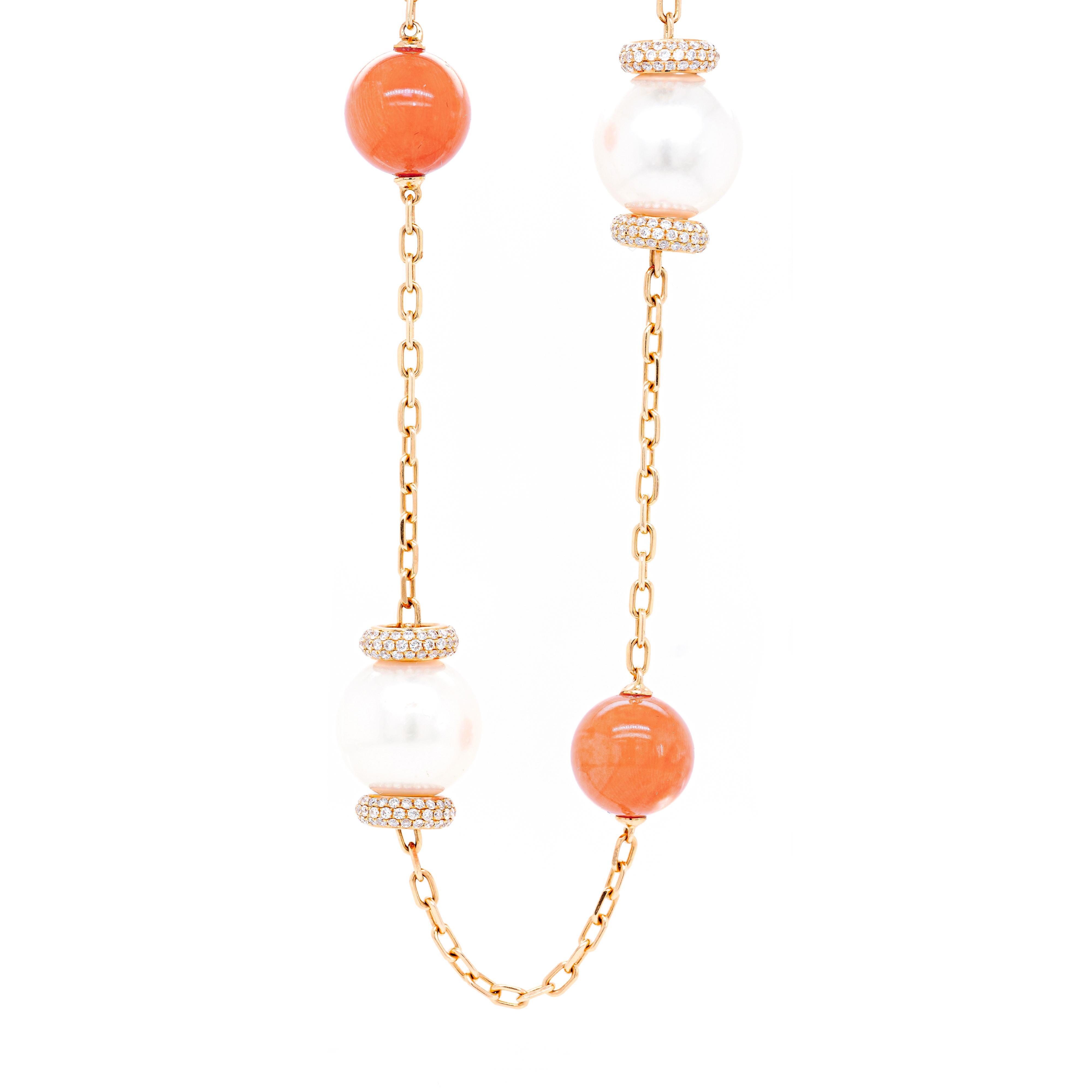 This long and elegant station necklace is beautifully designed with 9 round coral beads measuring 10.5mm, alternating with 10 cultured South Sea pearls measuring between 12.2-12.8mm, all spaced along a delicate 18 carat rose gold cable chain. Each