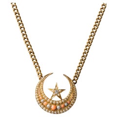 Coral, pearl and diamond Crescent pendant necklace, Early 20th Century