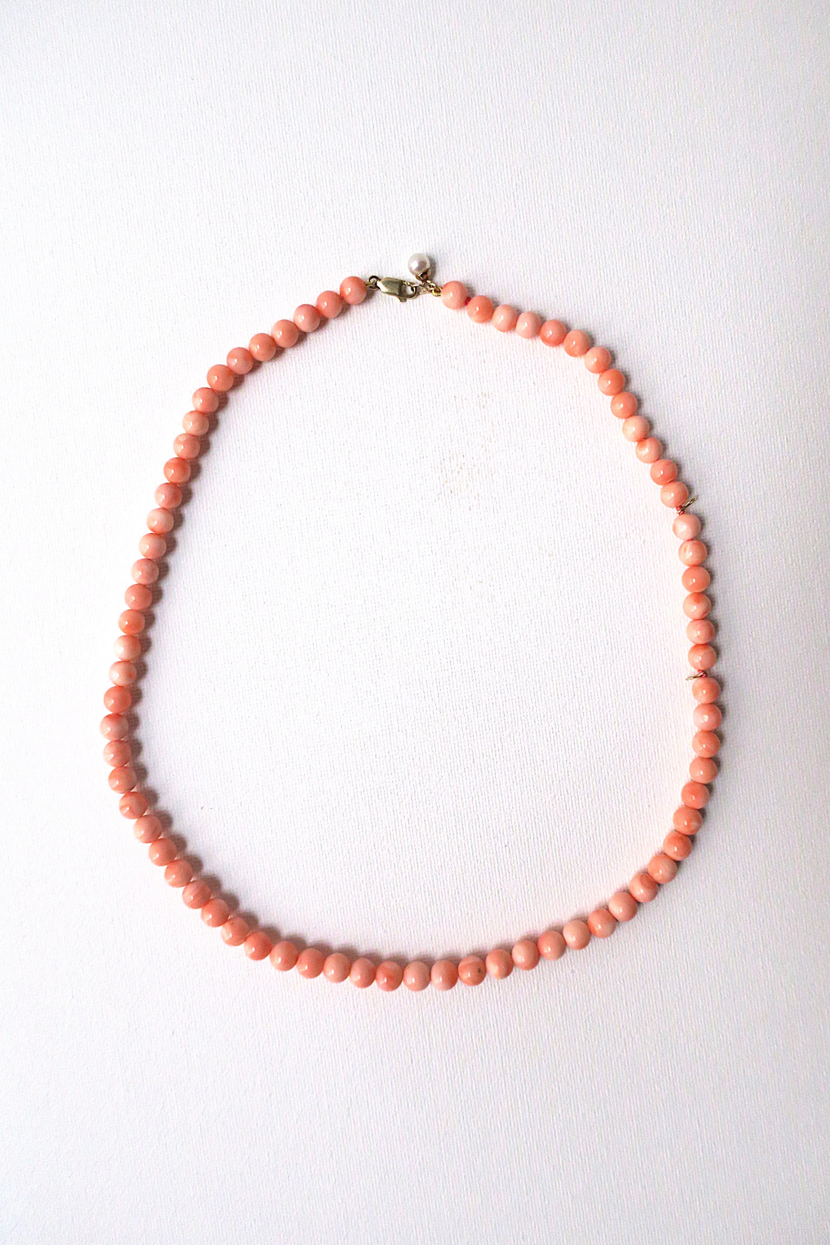 A beautiful coral bead necklace with cultured pearl accent. This one-of-a-kind necklace is three necklaces in one; Necklace can be worn in three (3) different length options (as demonstrated in images.) Necklace can be worn full length, collar