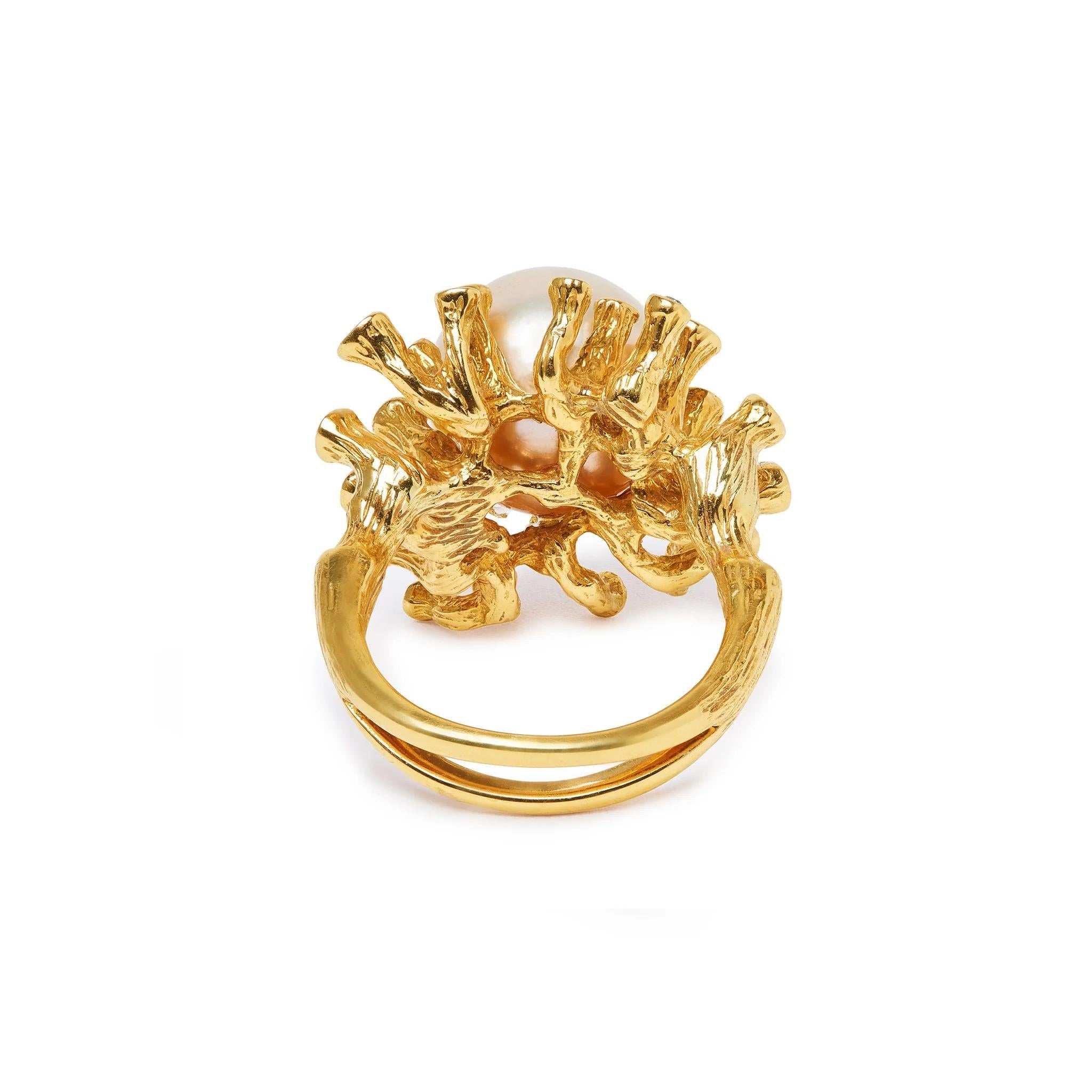 A handpicked Golden South Sea Pearl is surrounded with textured Diamond branches in 18k yellow gold in this stunning cocktail ring. Inspired by the beauty of coral, its intricate detailing and craftsmanship make a sublime statement.

Handmade 18k