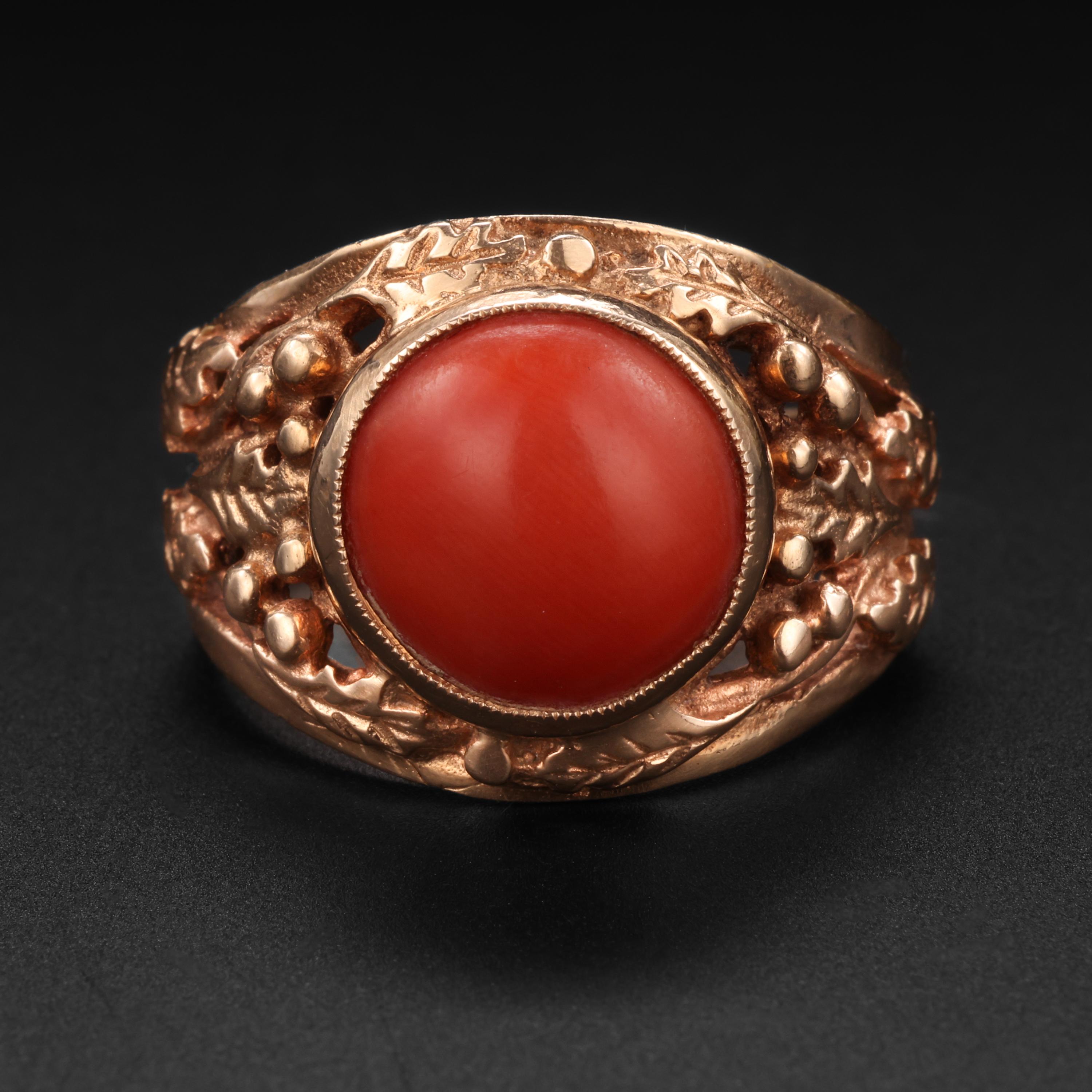 This richly ornate, entirely hand-fabricated 14K gold and coral ring would, at first glance, appear to be a Victorian-era ring. But the unmolested row of hallmarks on the rear of the shank testify to the fact that it was actually created in Warsaw