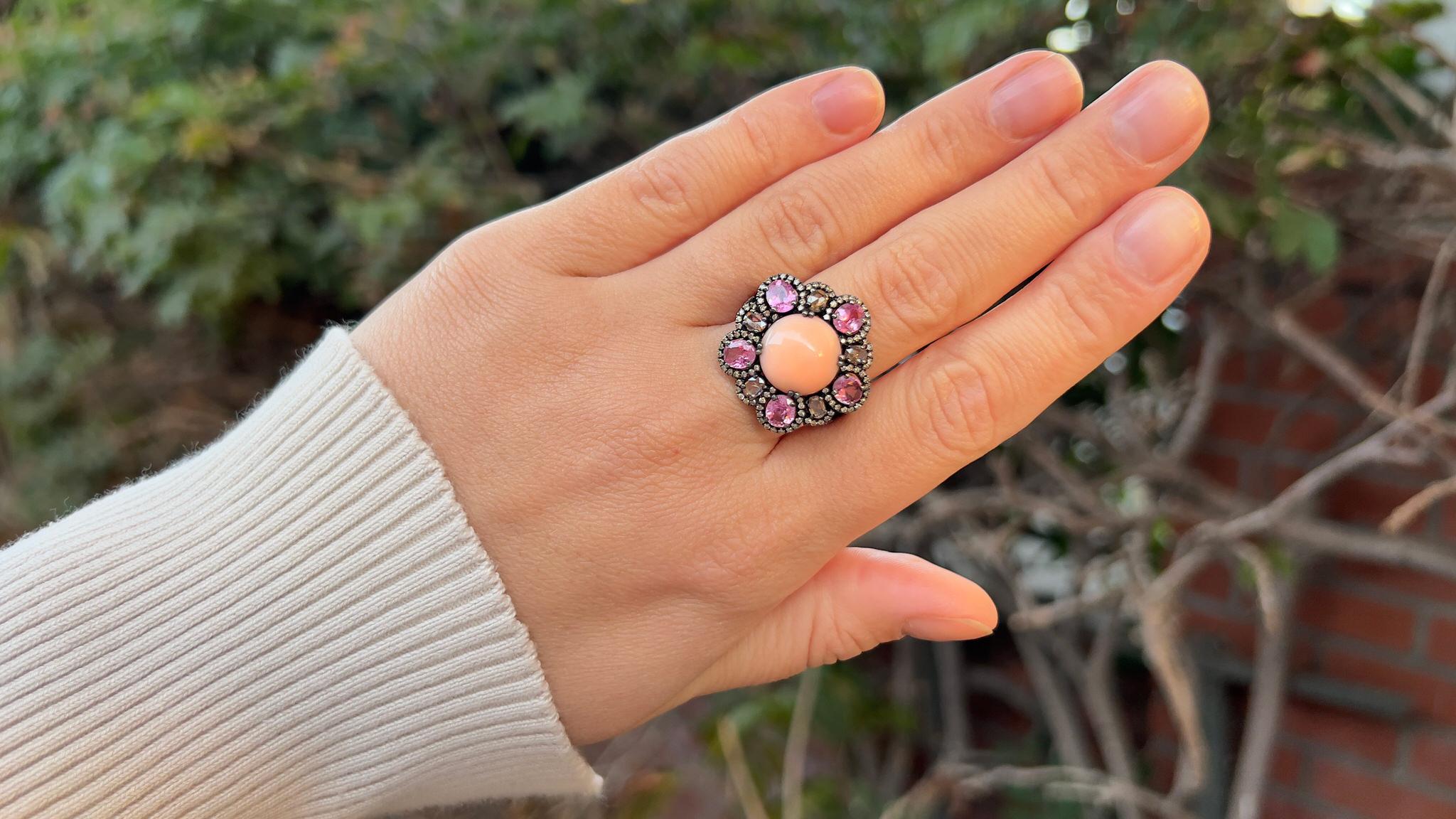 Coral
(Cut: Cabochon, Color: Orange, Origin: Natural)
Pink Sapphire = 2.30 Carat
(Cut: Oval, Color: Pink, Origin: Natural)
Diamond = 0.98 Carats
(Cut: Round, Color: F, Clarity: VS)
Metal = Silver
Ring Size = 6.5