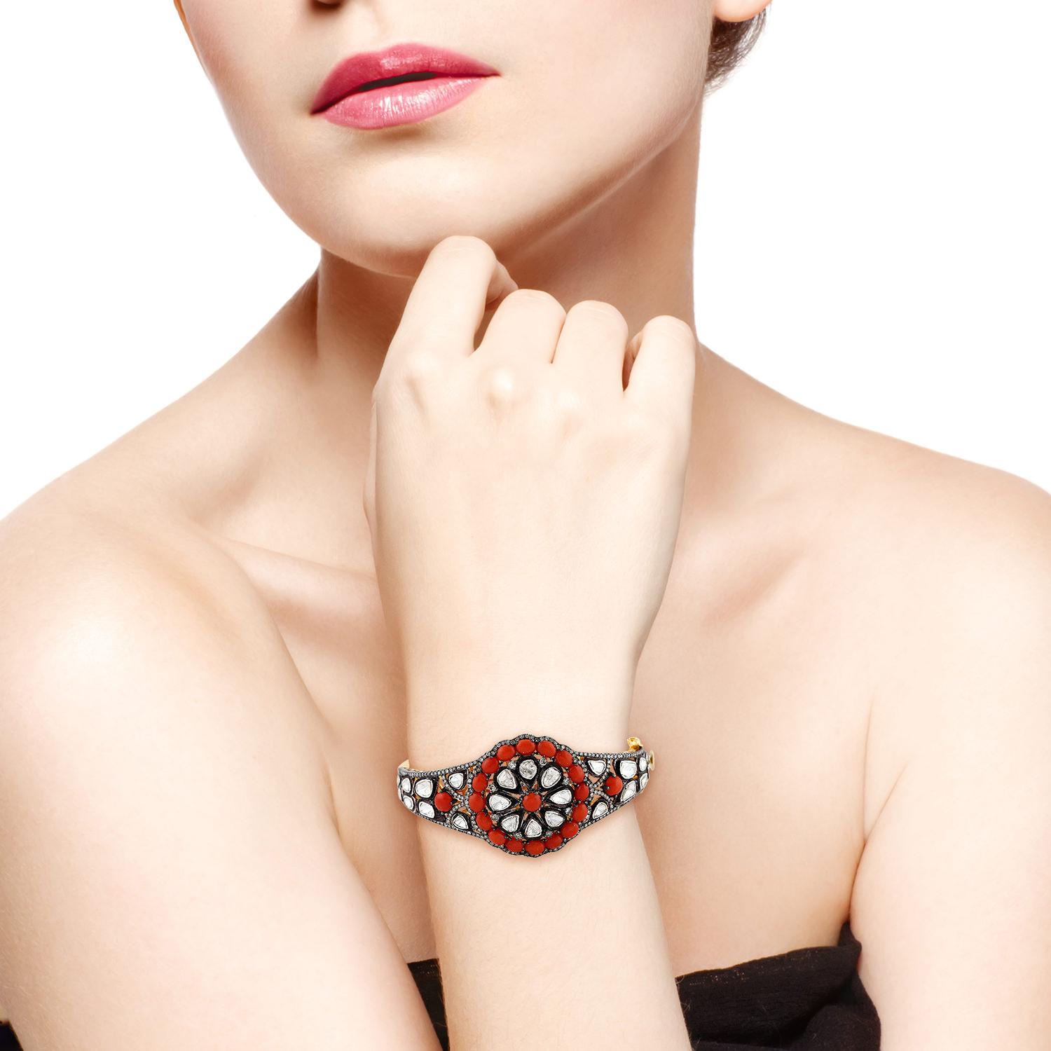 A stunning statement bracelet handmade in 18K gold and sterling silver. It is set in 6.9 carats coral and 5.58 carats of uncut & rose cut diamonds in blackened finish. Clasp Closure

FOLLOW  MEGHNA JEWELS storefront to view the latest collection &