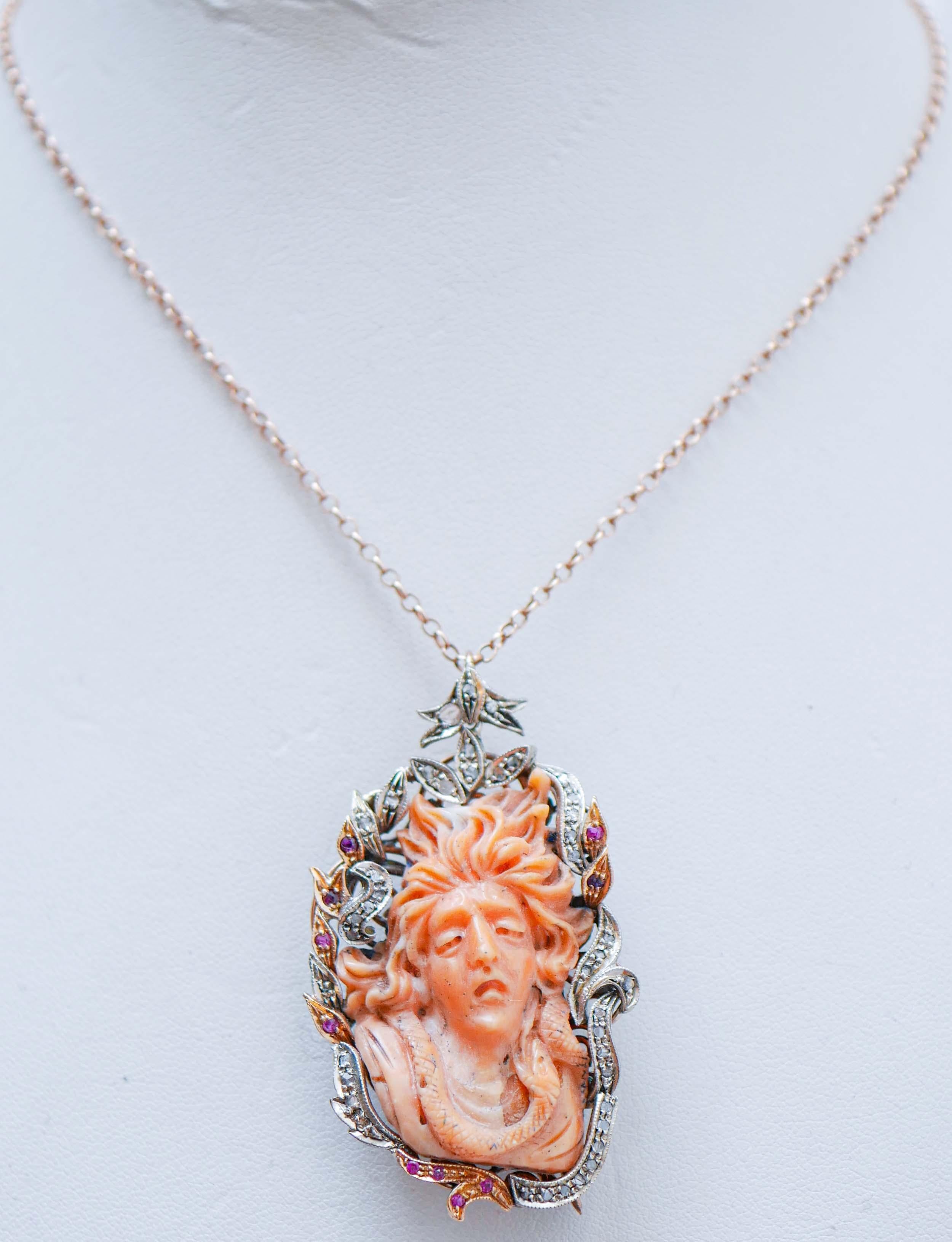 Brooch/Pendant in 9 kt rose gold and silver sturcture mounted with a carved coral surrounded by diamonds and rubies.
This brooch was totally handmade by Italian master goldsmiths and it is in perfect conditions.
The brooch will come with a silver