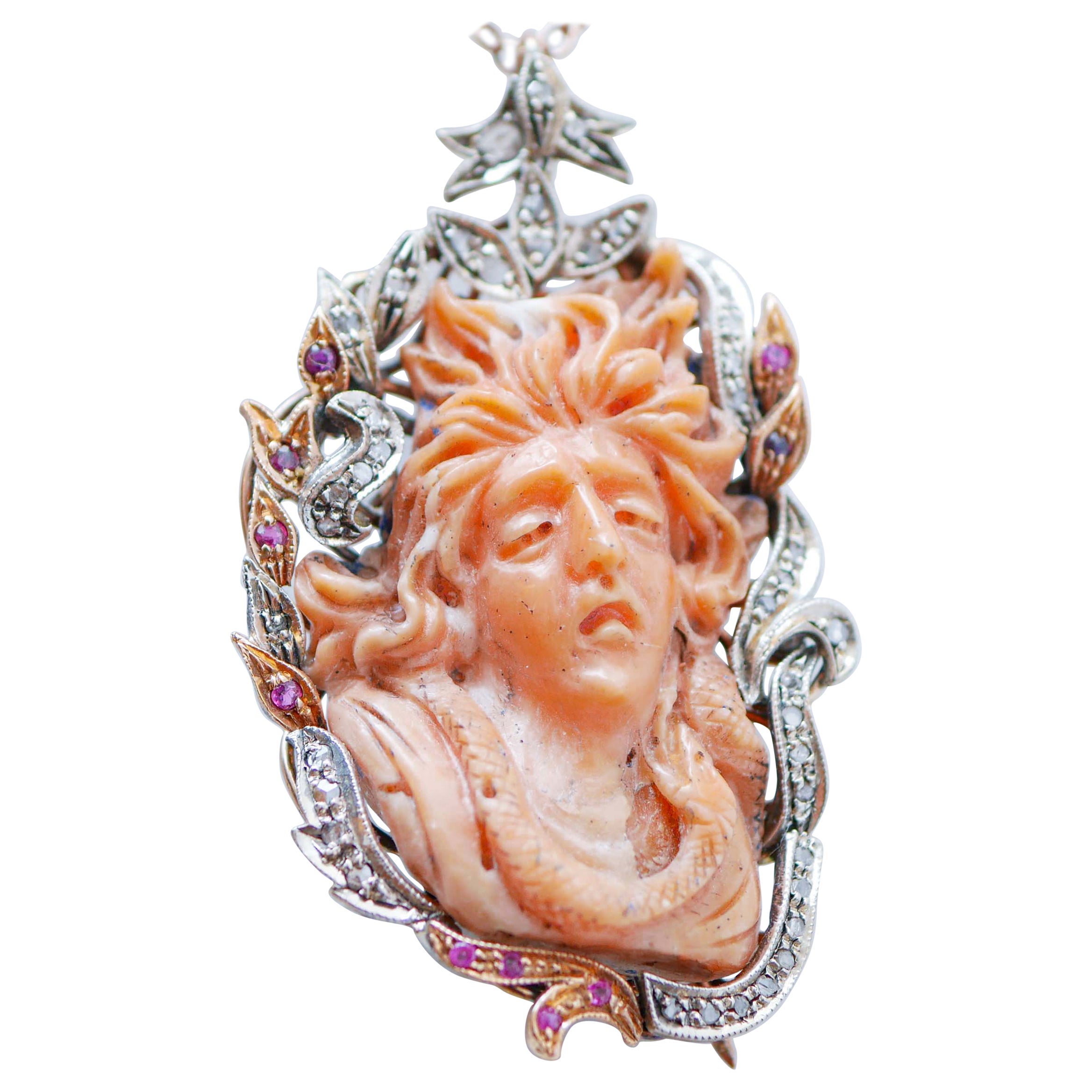 Broche/colgante de coral, rubíes, diamantes, oro rosa y plata.