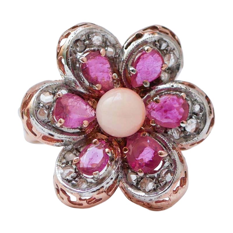 Bague en corail, rubis, diamants, or rose et argent.