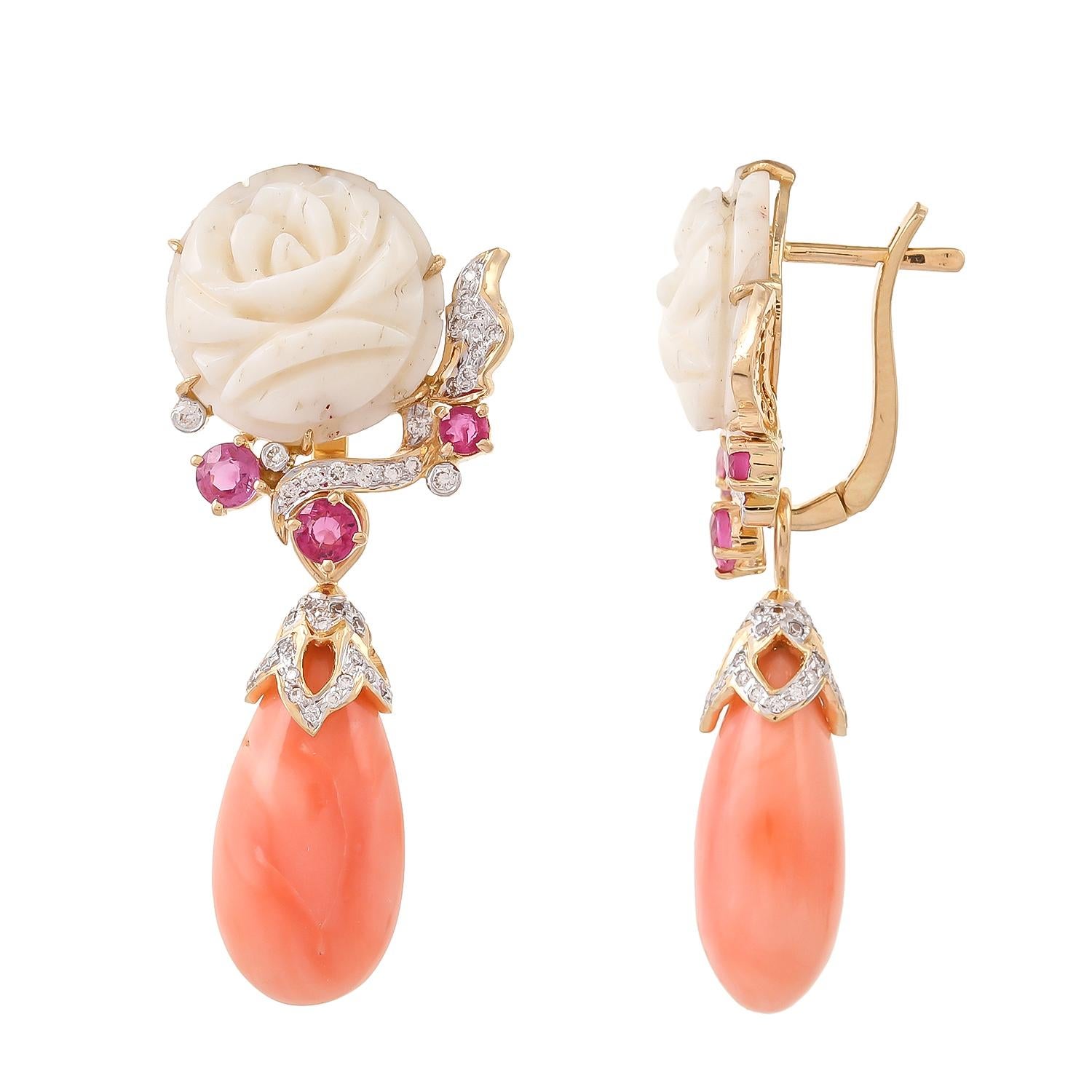 These elegant pair of pink coral earrings crafted in 18 karats yellow gold, features the beauty of carved in sublime white coral, further enhanced with round ruby and sparkling white diamonds. Clip-on back earrings can be worn as studs by removing