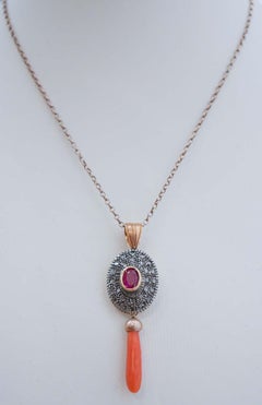Coral, Ruby, Diamonds, 14 Karat Rose Gold and Silver Pendant Necklace.