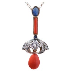 Coral, Sapphires, Diamonds, 14 Karat Rise Gold and Silver Pendant.
