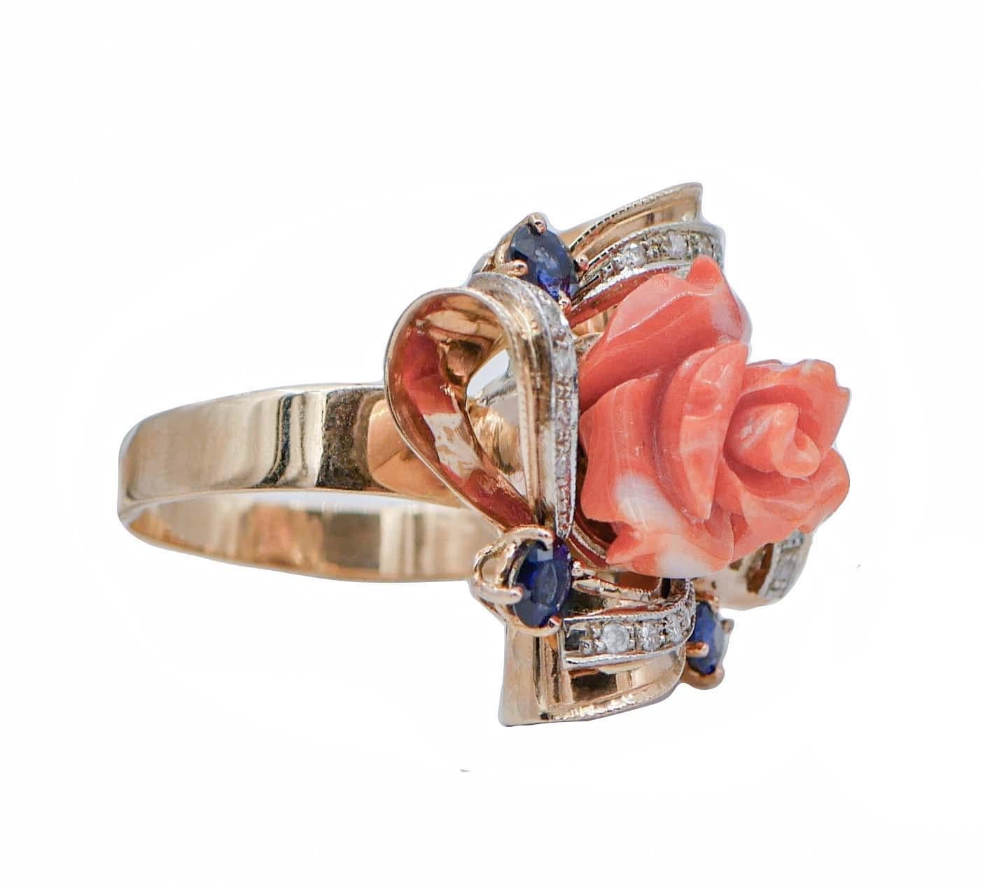 Beautiful ring in 14 kt rose gold structure mounted with a central coral surrounded by sapphires and details in white gold studded with diamonds.
This ring was totally handmade by Italian master goldsmiths and it is in perfect conditions.
Diamonds