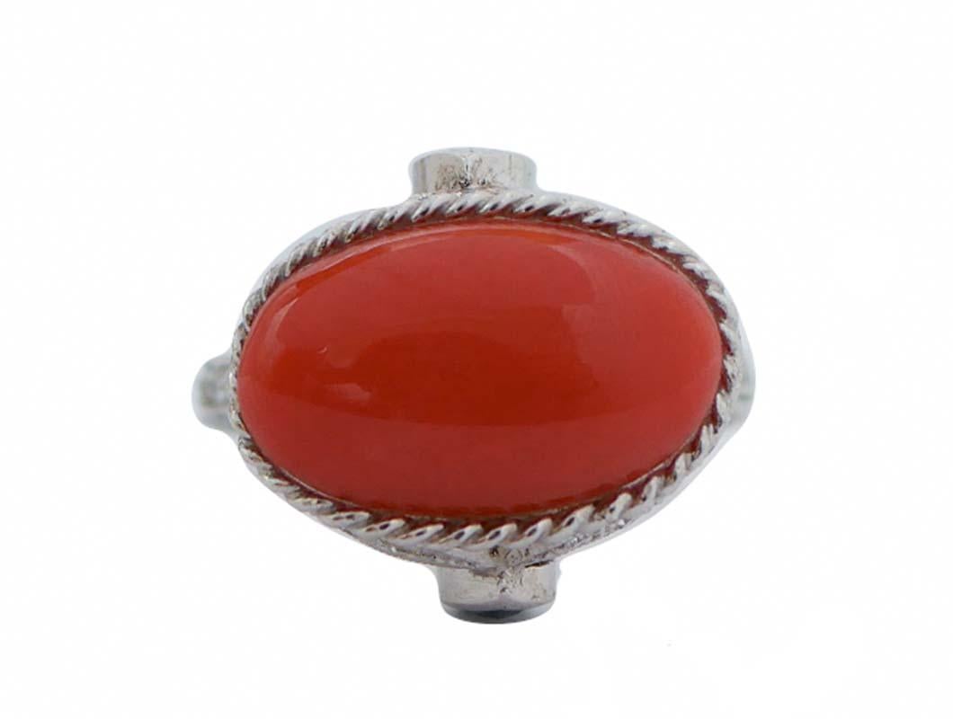 Amazing ring in platinum structure mounted with a central coral  surrounded by diamonds and two drop sapphires.
This ring was totally handmade by Italian master goldsmiths and it is in perfect conditions.
Diamonds 1.07 ct
Sapphires 0.75 ct
Coral