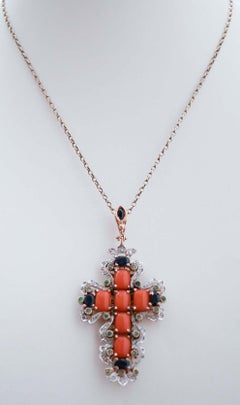 Coral, Sapphires, Emeralds, Diamonds, Rose Gold and Silver Cross Pendant.