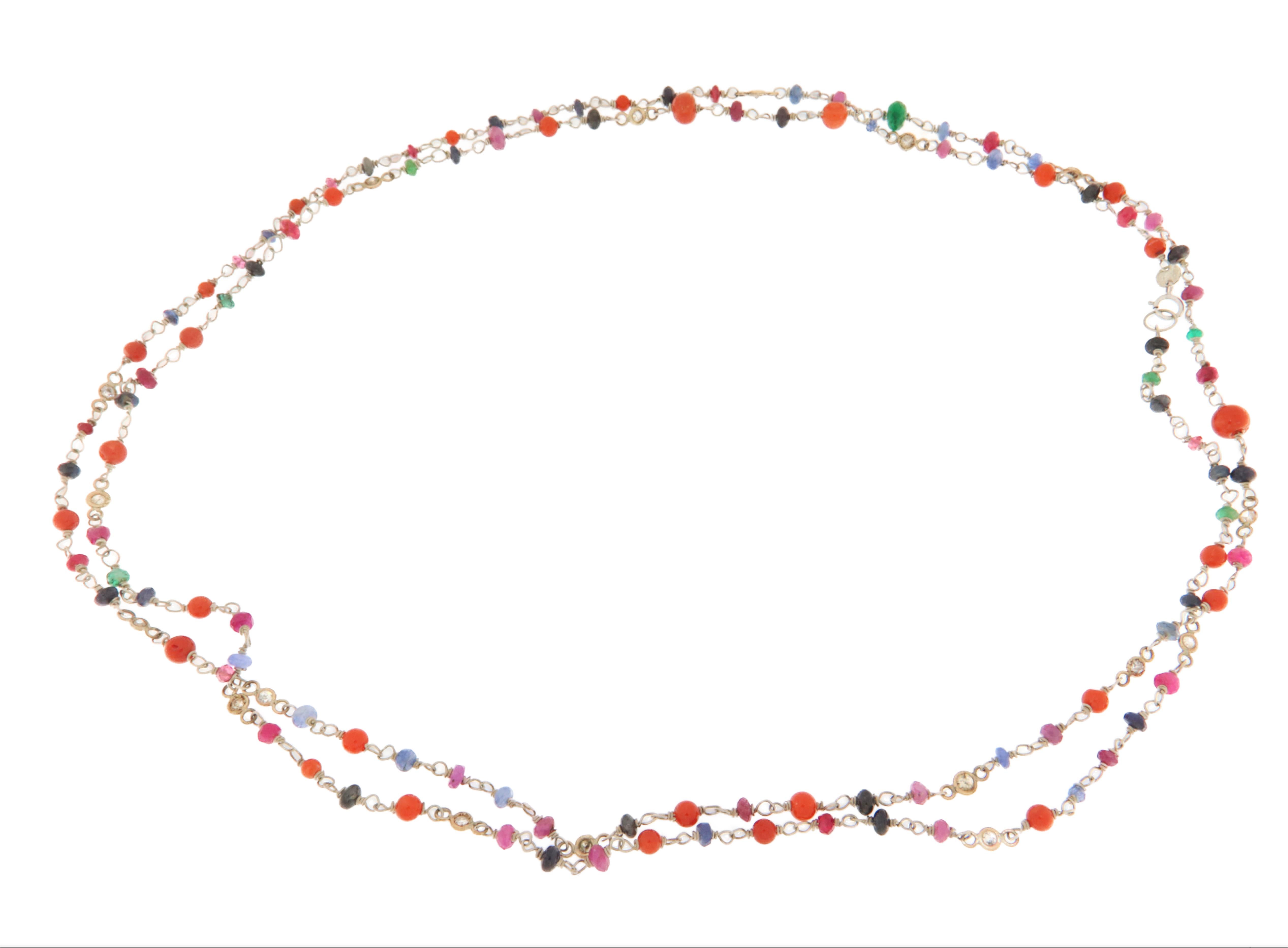 A perfect blend of elegance and vibrant colors, this necklace crafted in 9K gold and 800 silver is a refined piece of jewelry that enhances the brilliance of diamonds, sapphires, rubies, emeralds, and coral beads.

Designed with a delicate chain,