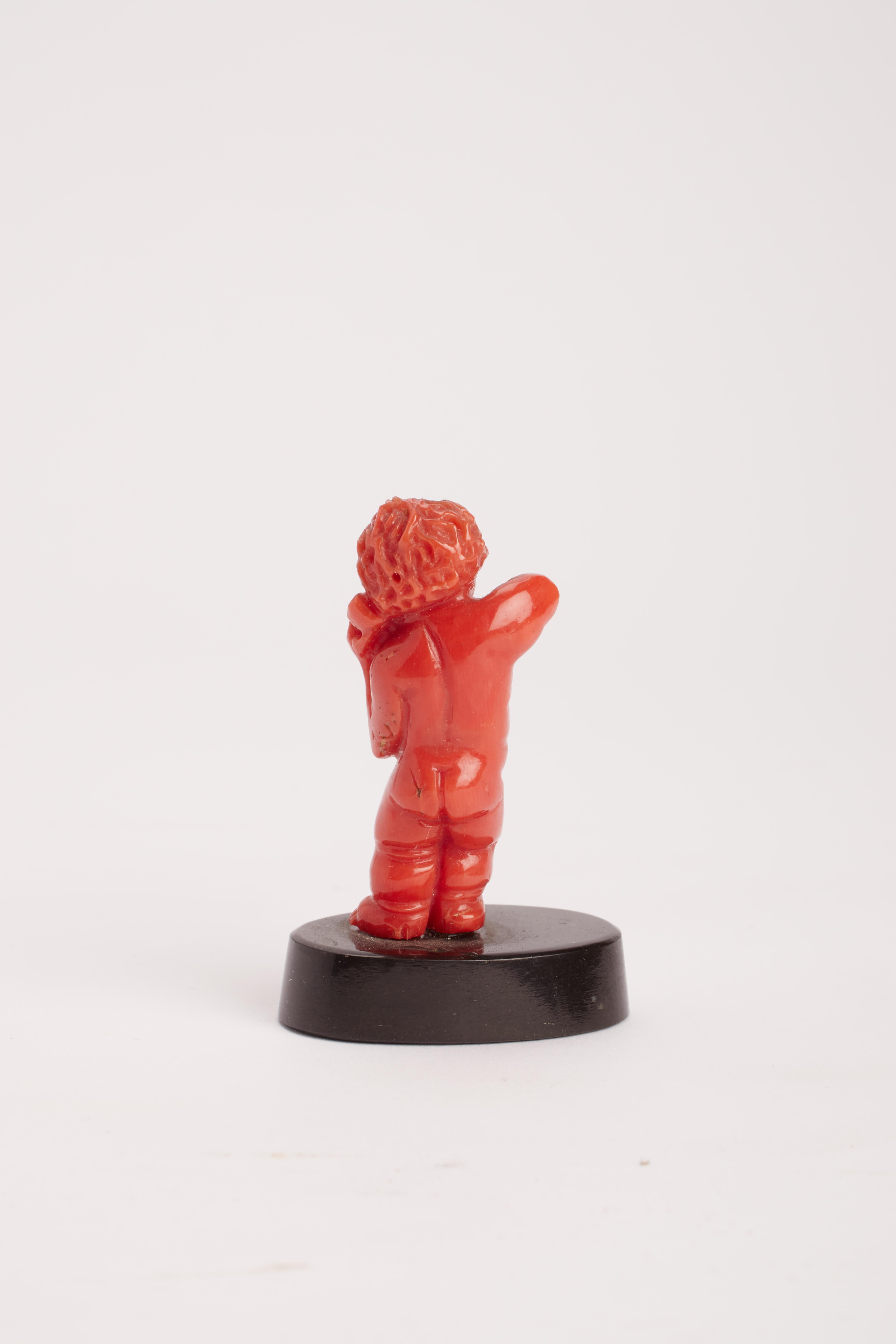Italian Coral sculpture of a putto, Italy 1860.  For Sale