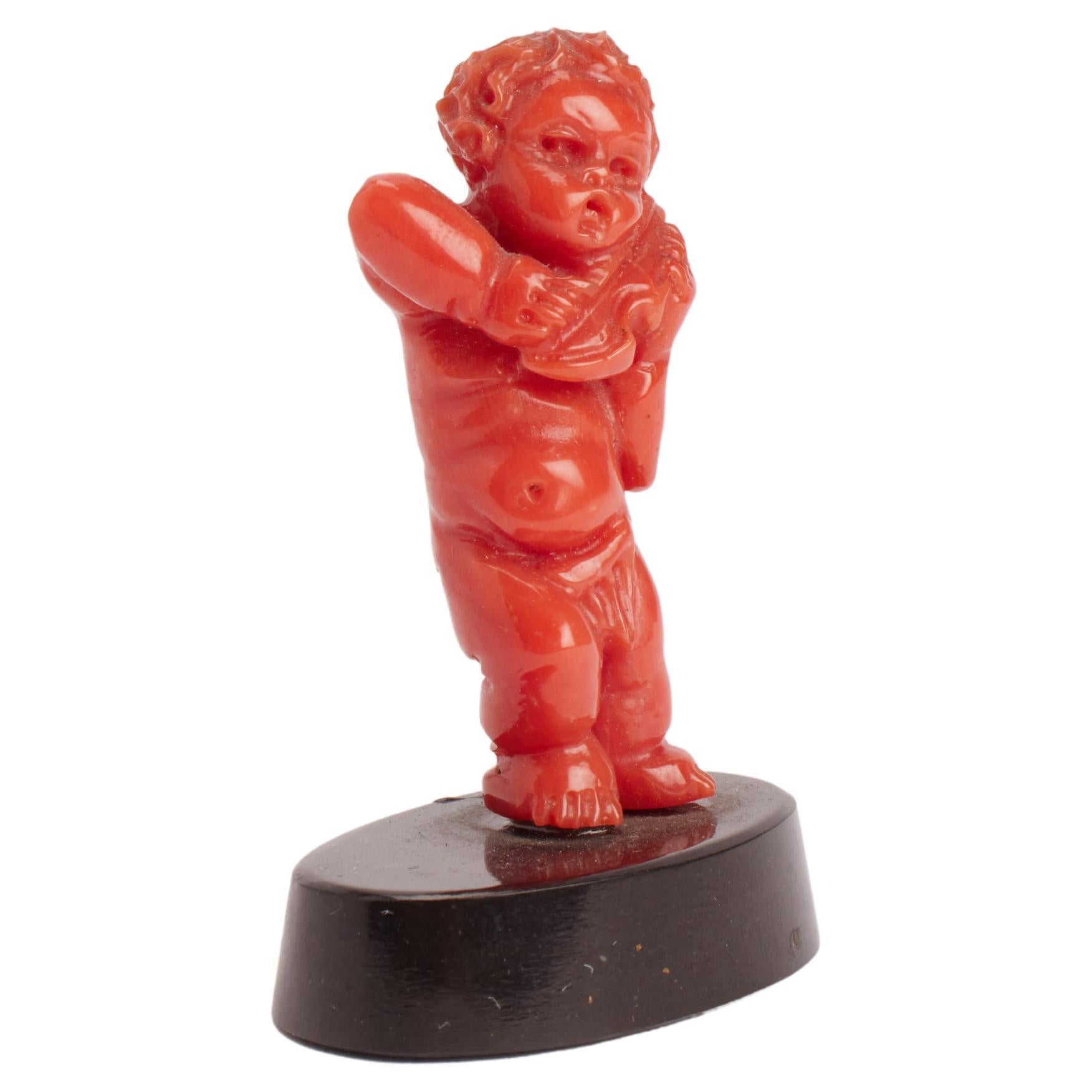 Coral sculpture of a putto, Italy 1860. 