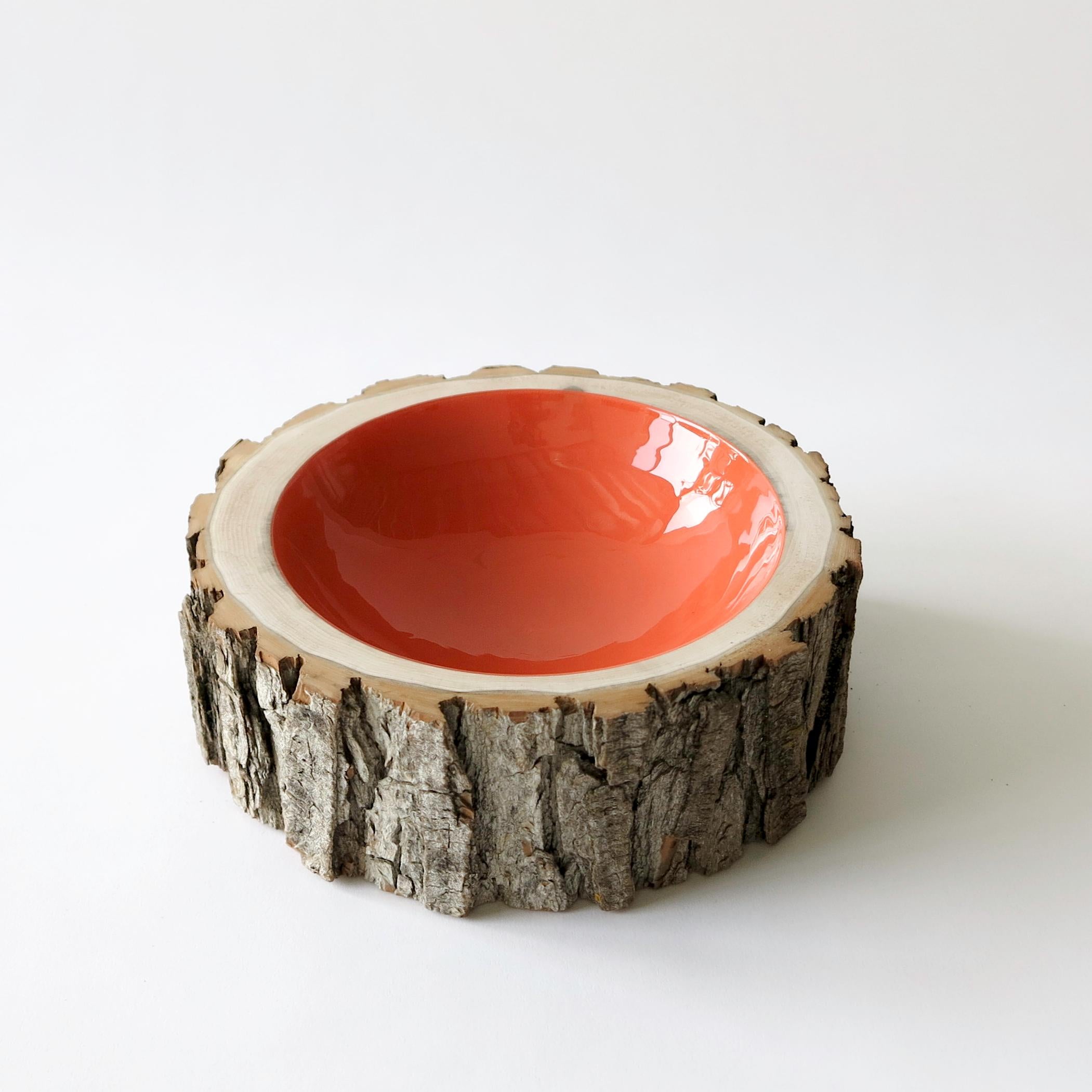 Log bowls combine the beauty of a tree in its natural state with a high-gloss, vibrant finish. Each bowl is handmade using locally reclaimed trees of all varieties (fallen or cut down due to infrastructure or inclement weather). The trees are hand